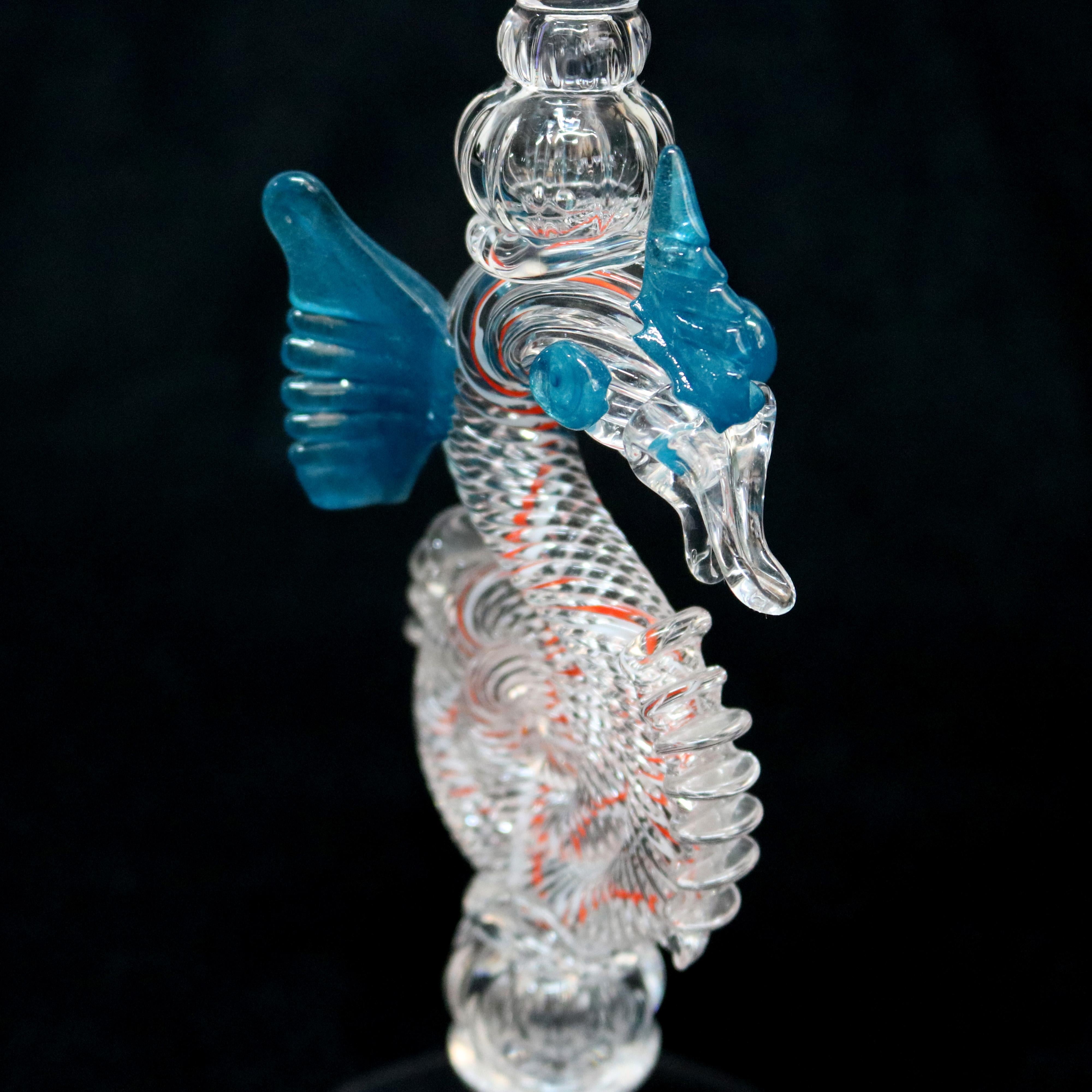 Steuben Venetian style Dragonglass wine goblet by William Gudenrath features cylindrical bowl surmounting peppermint seahorse with cobalt blue wings, signed and dated on base, circa 2000

Measures: 11
