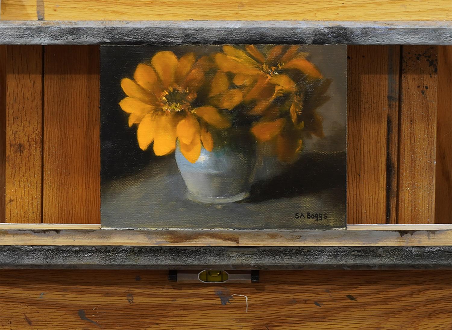 <p>Artist Comments<br>A soft blue and gray clay vase overflows with vibrant orange flowers, rendered in chiaroscuro. Light and shadow bring some petals into sharp detail while others fade softly into darkness, creating a dynamic contrast. The