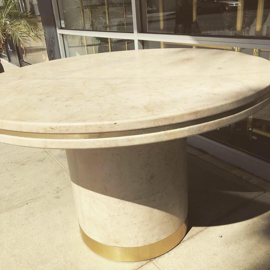 This beautiful simple and modern table was designed by the late, great Steve Chase. It was custom-made for a residence in Rancho Mirage, California. Entirely covered in parchment to look like Goatskin, it has a beautiful brushed brass trim.