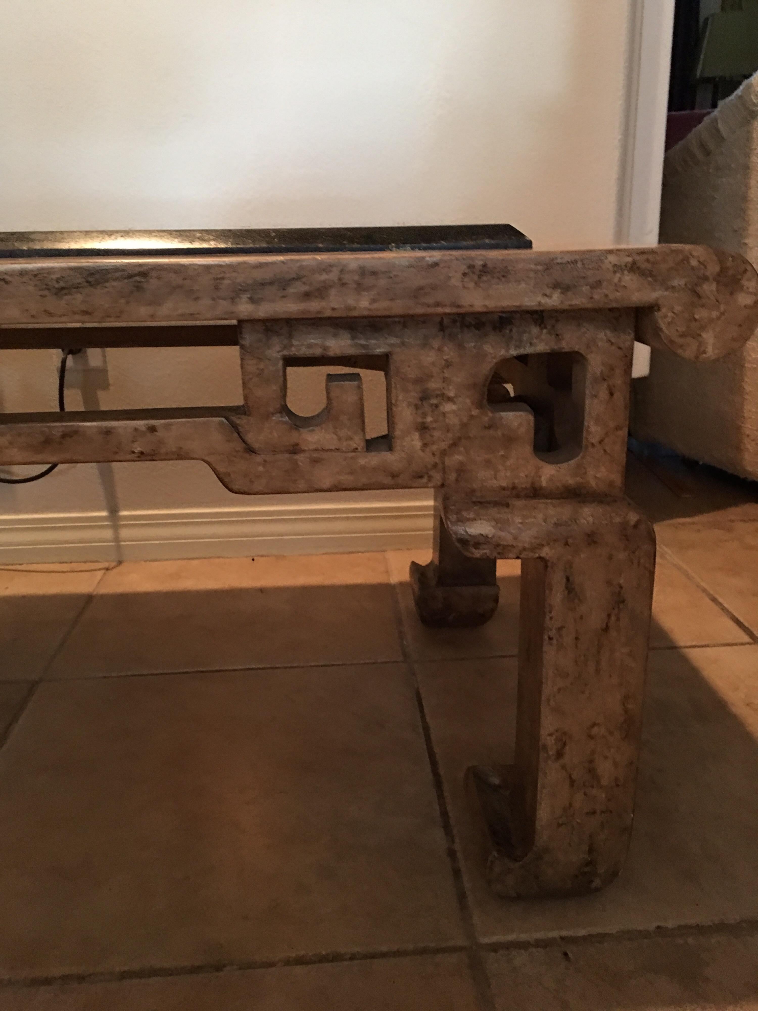 This table was custom made by the legendary Steve Chase specifically for a Thunderbird Cove estate. Although the residence was entirely modern there were many chinoiserie influences in the art and furniture. The black granite top floats over a