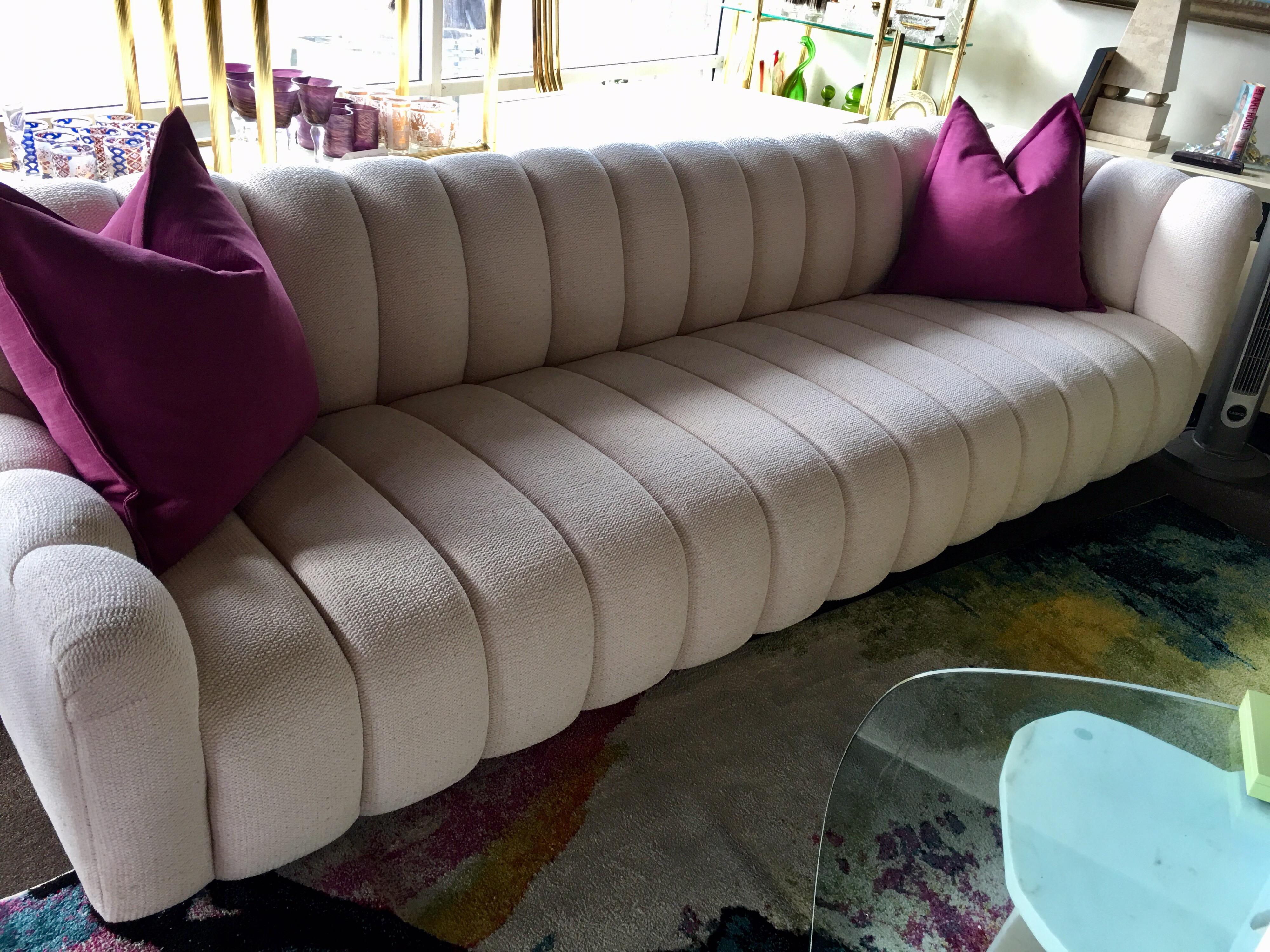 This sofa has become an iconic piece of Palm Springs upholstered furniture. Both Steve Chase and Gary Jon custom made these pieces for upscale, architectural residences in the late 1970s and 1980s. This prime example was designed by Gary Jon, a