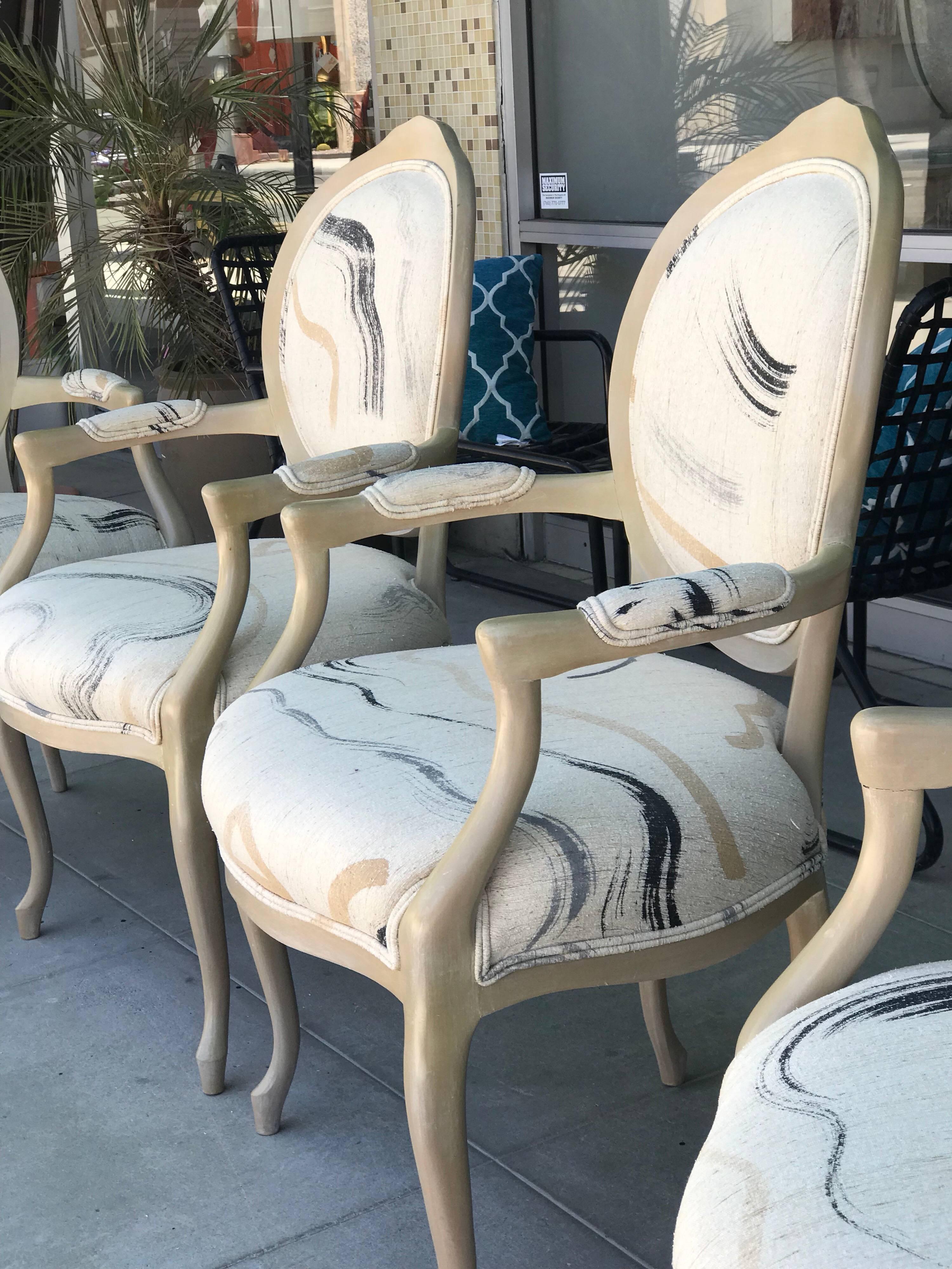 These very chic chairs came from a Palm Desert Estate designed by the late Steve Chase. What makes them special are the hand painted raw silk. Done in a very modern and current abstract art style. Each chair different, with perfectly placed print.