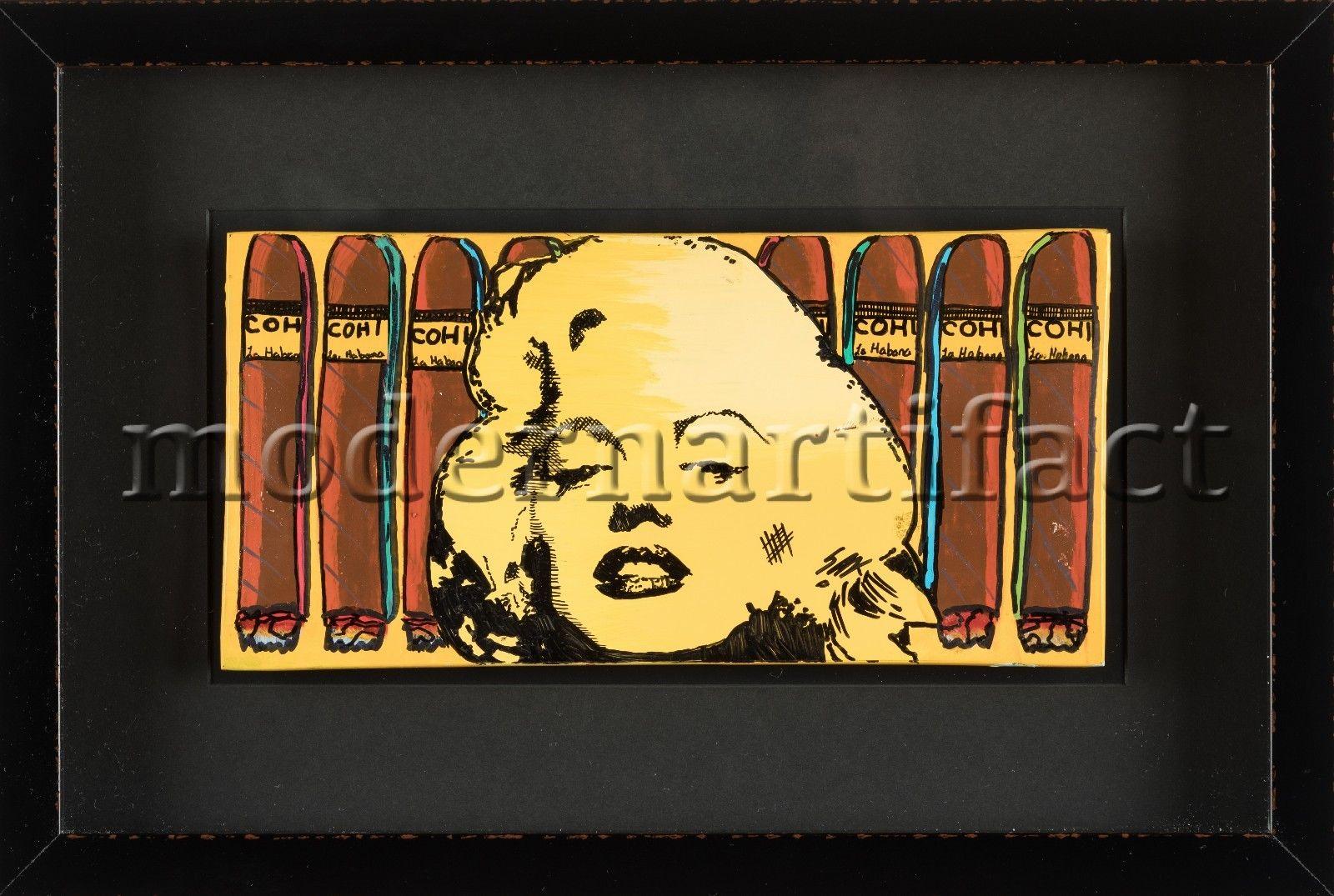 Artist: Steve Kaufman
Title: Marilyn Cohiba
Medium: Hand Painted Acrylic and Ink over Ash Tray
Size: 6.6" x 13"
Size Framed: 13.5" x 20.25"
Edition size: No edition all original 1/1

Condition:  The piece is in excellent condition and has been newly
