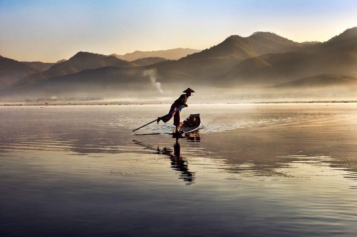 Steve McCurry Color Photograph - Intha Fisherman on Inle Lake, Burma