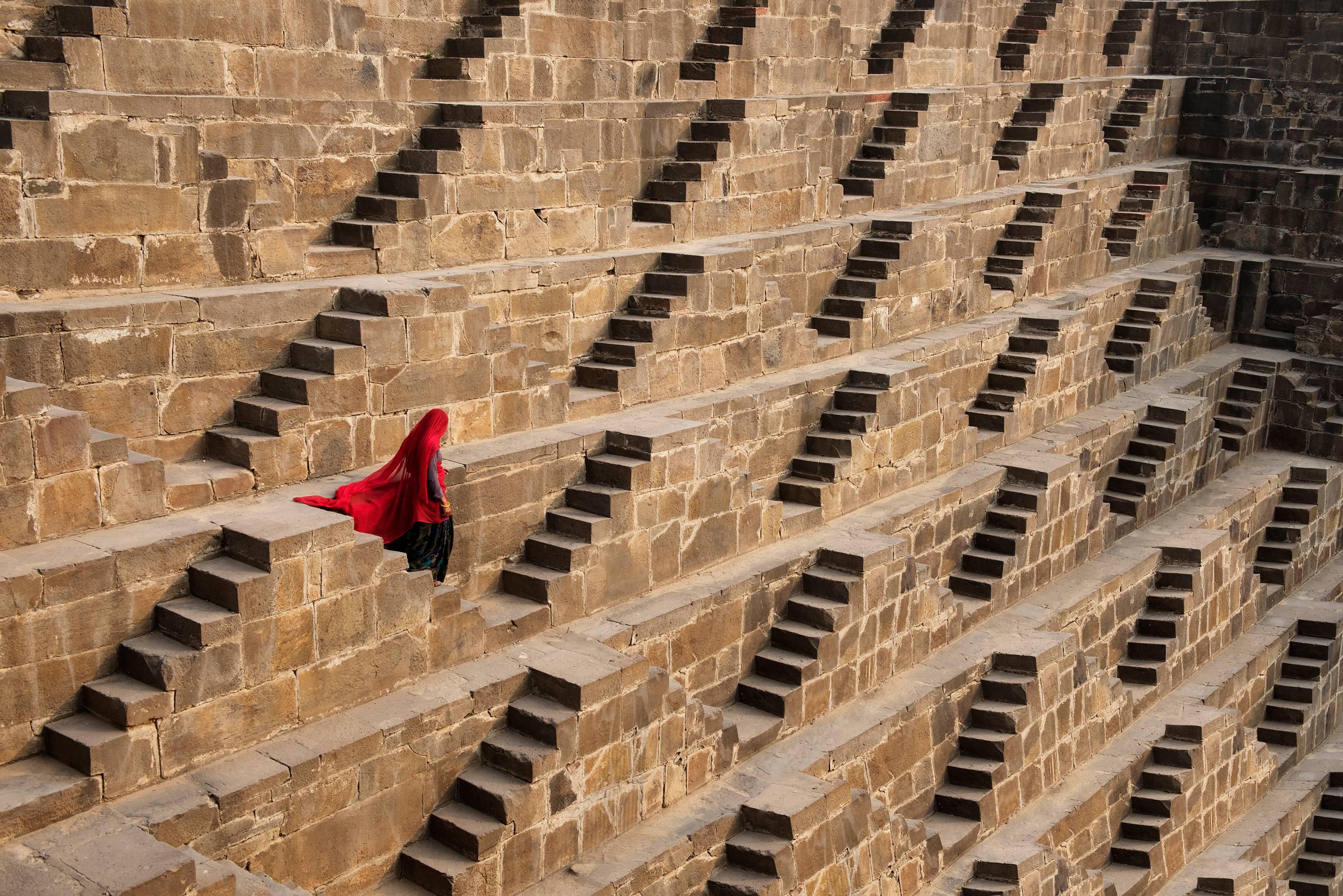 Steve McCurry Color Photograph - Woman in Chand Baori Stepwell