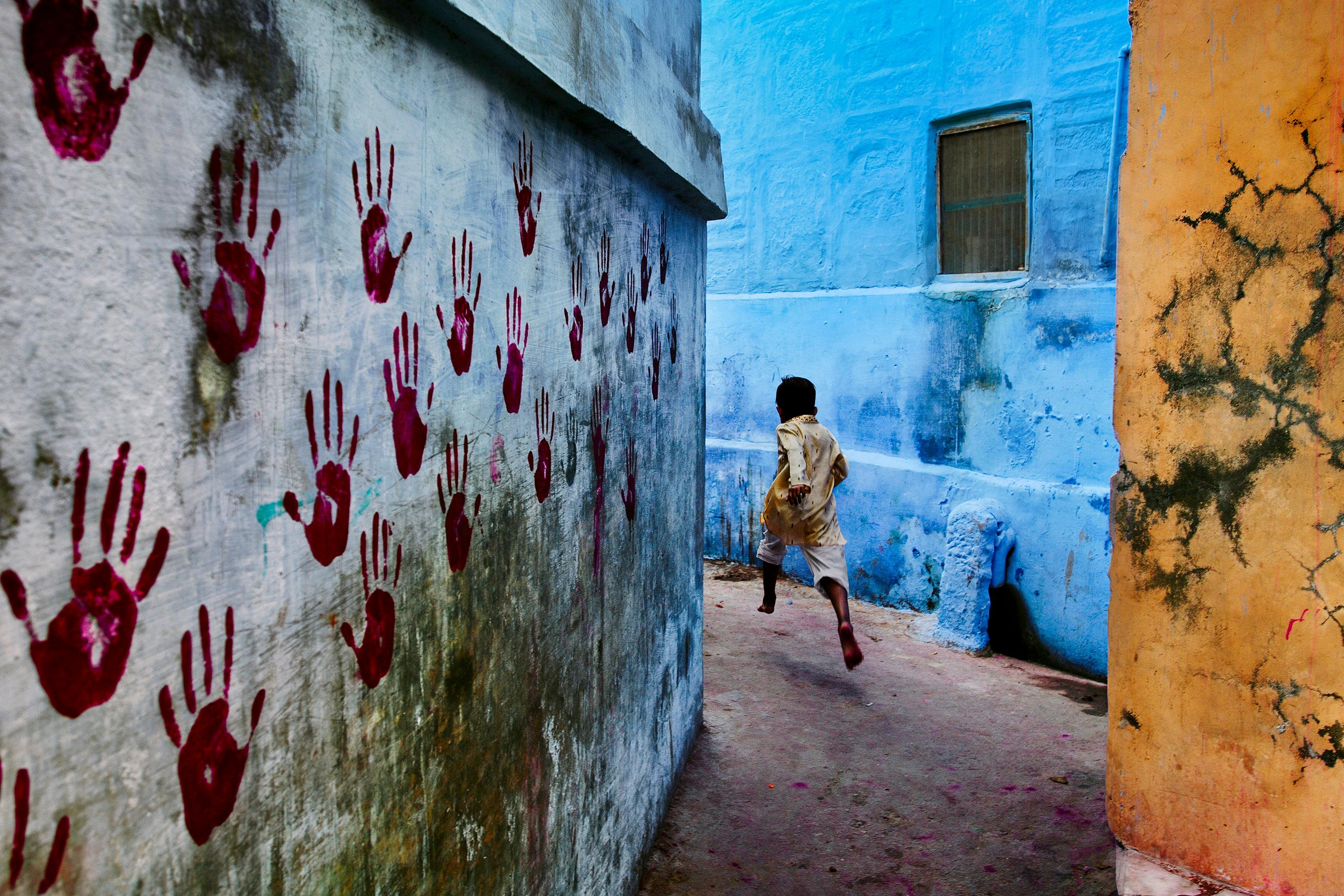 Boy In Mid-Flight, Jodhpur, India, 2007 - Steve McCurry (Colour Photography)
Signed and affixed with photographer's edition label and numbered on reverse 
Digital c-type print 

20 x 24 inches, edition of 90
24 x 30 inches, edition of 75

Steve