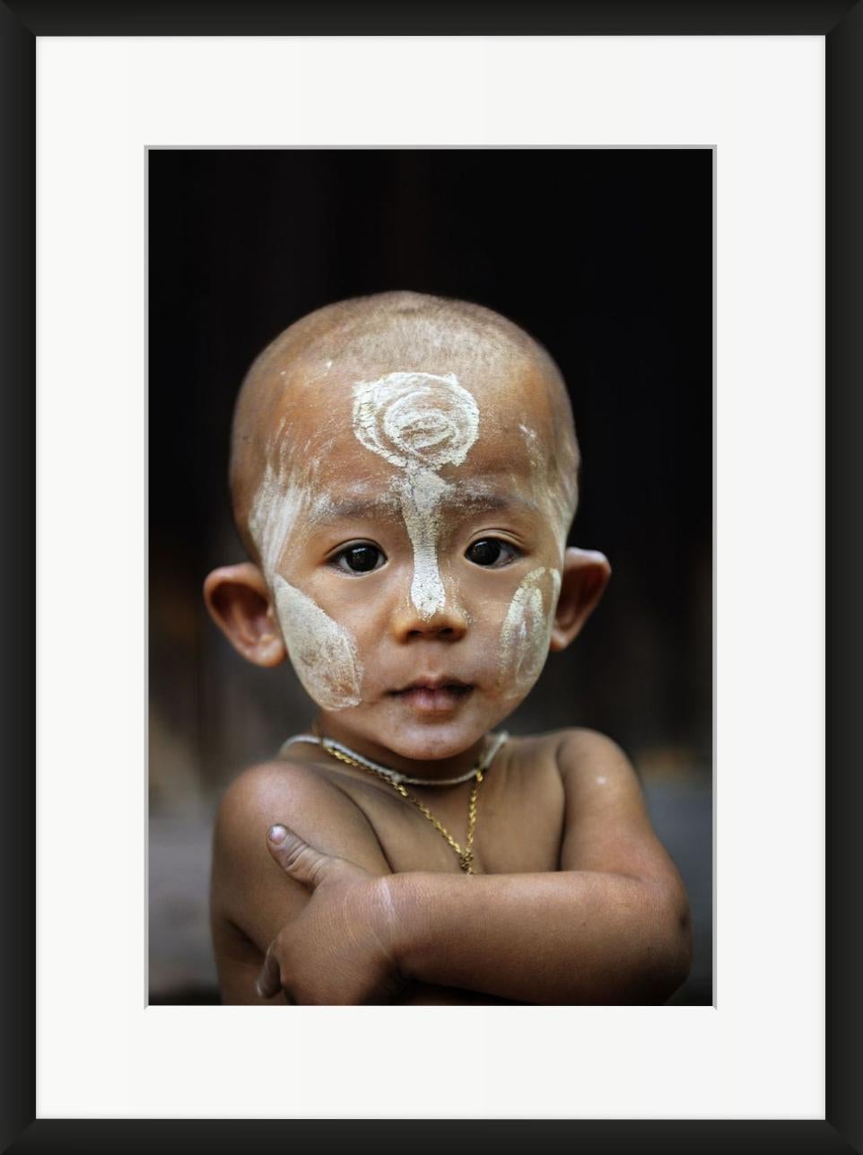 Child with Thanaka on Face - Photograph by Steve McCurry