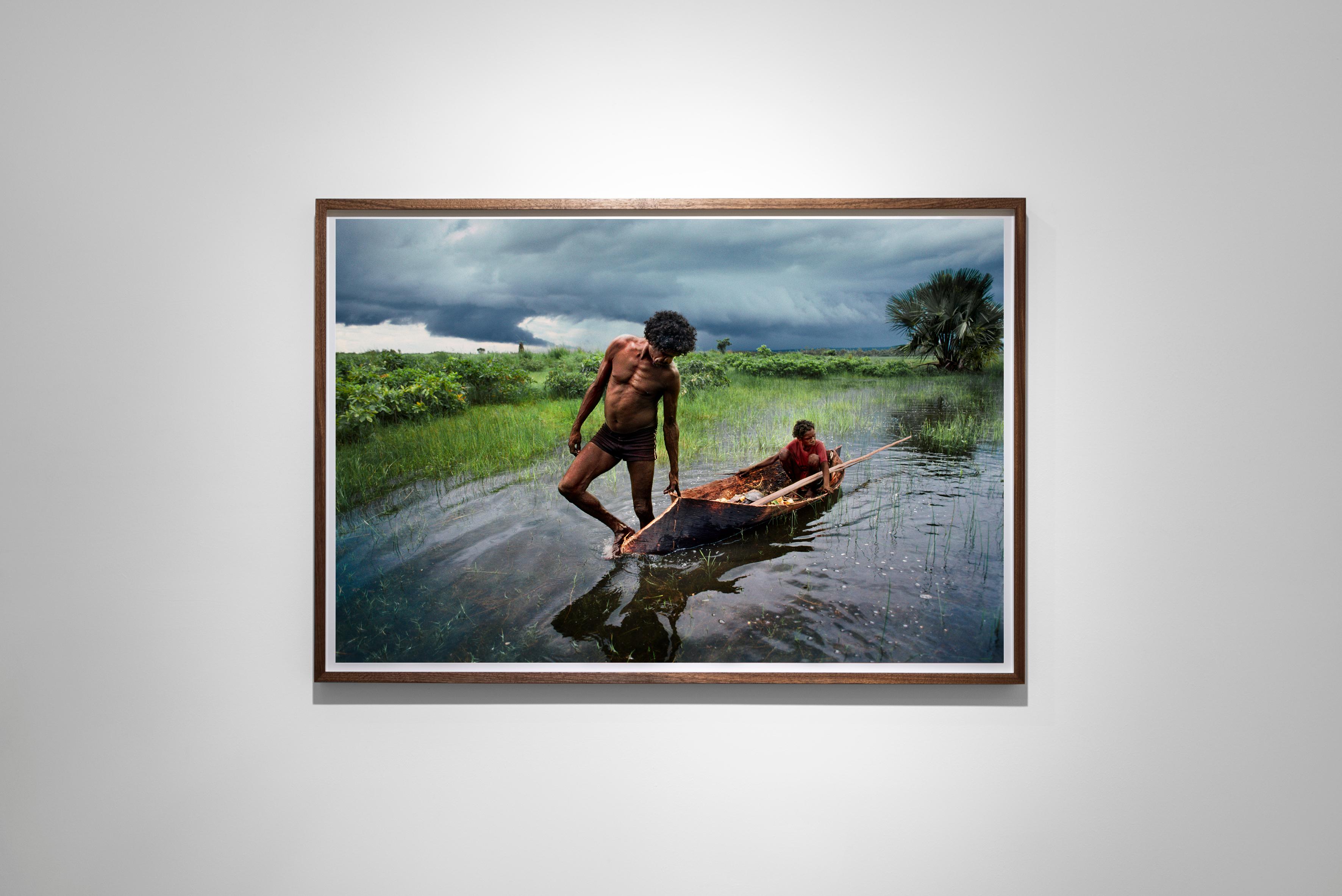 Father and Son Hunt in a Canoe, Northern Territory, Australia, 1984  - Photograph by Steve McCurry