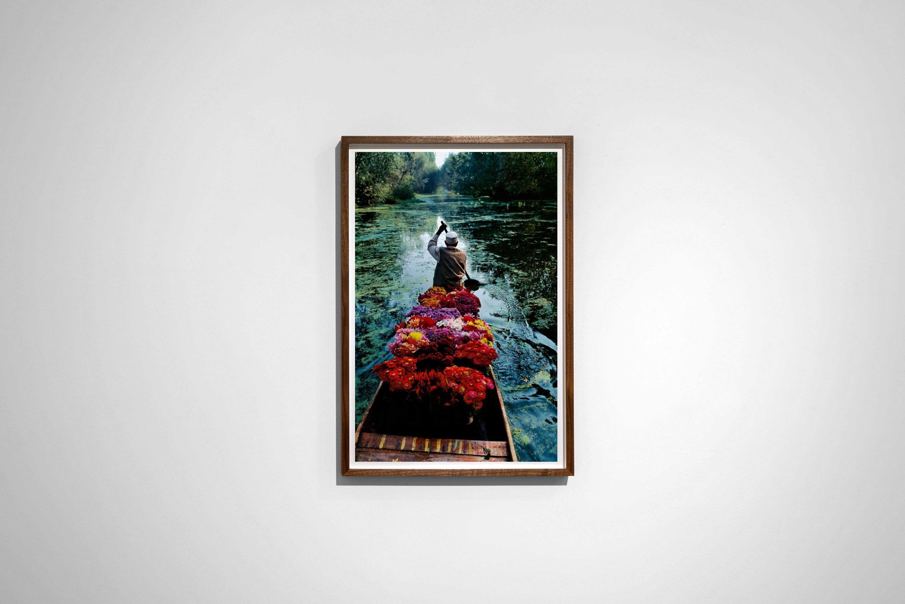 Flower Seller, Dal Lake, Srinigar, Kashmir, 1996 - Steve McCurry 
Signed and affixed with photographer's edition label and numbered on reverse
Digital c-type print
Printed on 20 x 24 inch paper
Edition of 90

Steve McCurry (born 1950) is best known