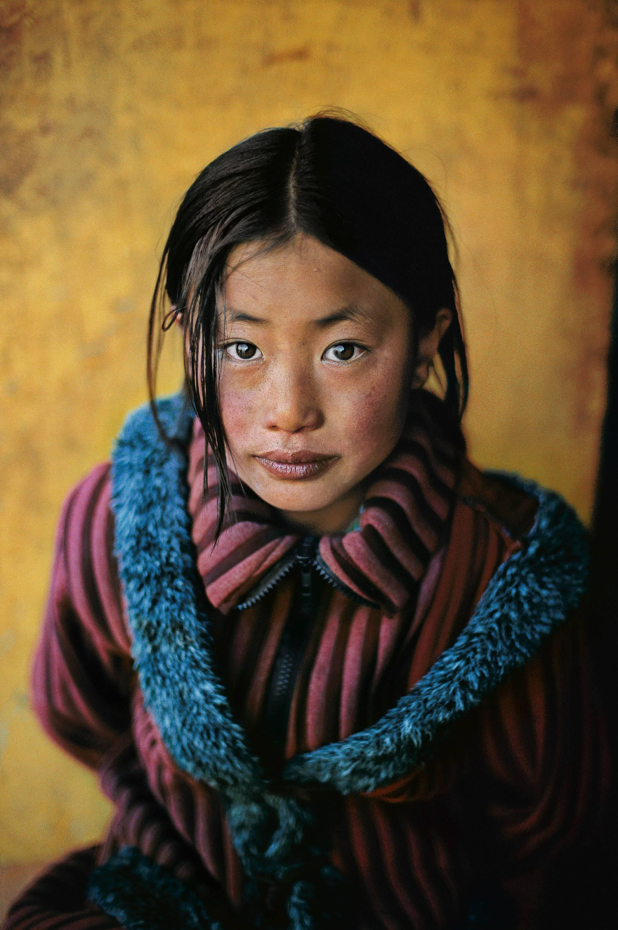 Girl in New Coat, Xigaze, Tibet, 2001 - Steve McCurry (Colour Portrait)