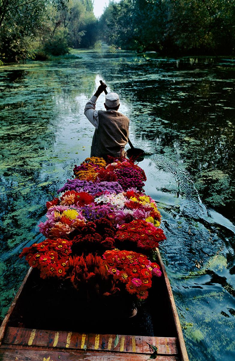 Kashmir Flower Seller by Steve McCurry is listed as a 24 x 20 inch digital c-print, available in an edition of 90. This photograph is printed on FujiFlex Crystal Archive Supergloss Paper. It is signed on print verso by Steve McCurry, and inscribed