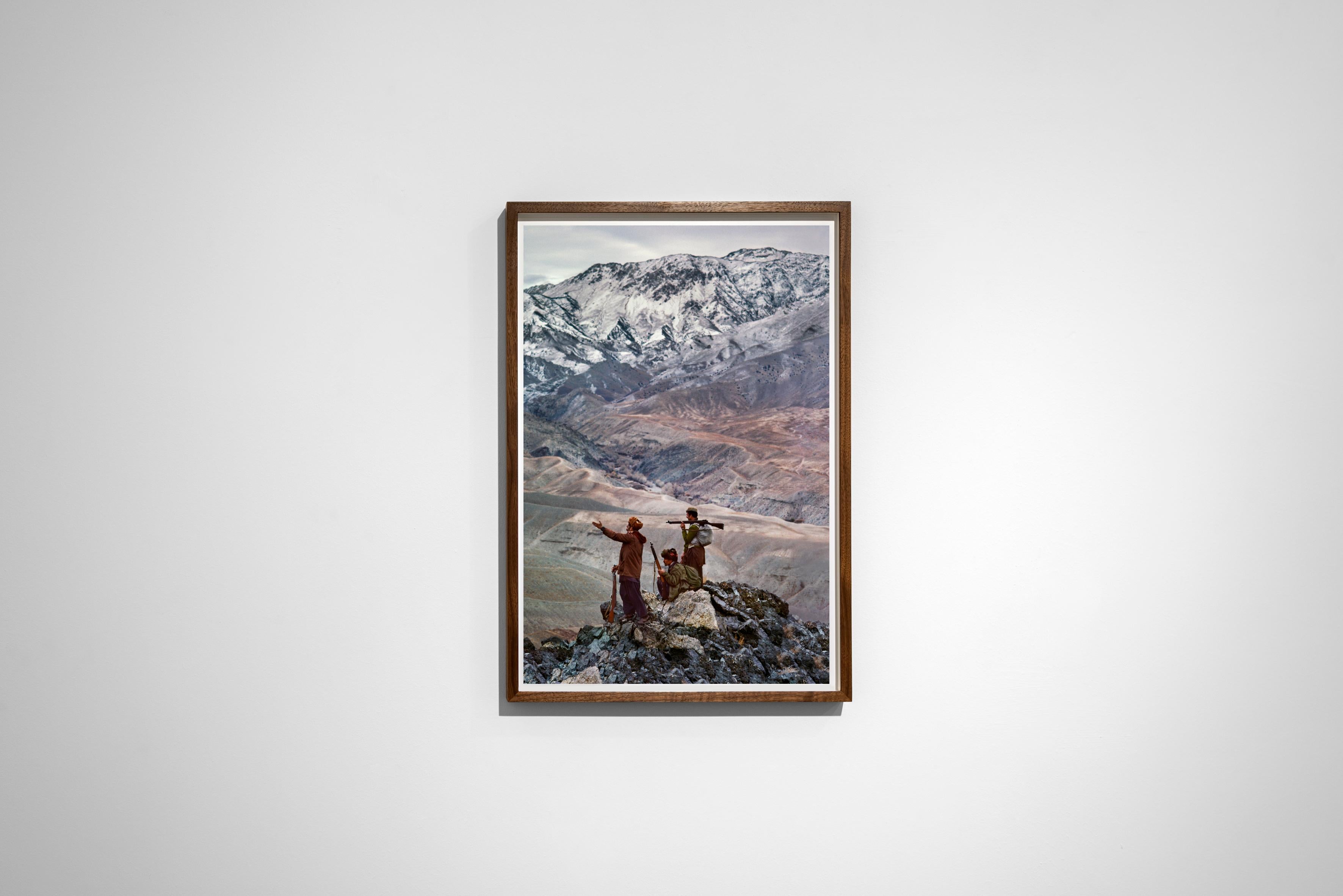 Mujahideen Stand Atop a Mountain in the Hindu Kush, 1984 - Steve McCurry 
Signed and numbered on photographer's edition label on reverse 
Digital c-type print

Printed on 20 x 24 inch paper
Edition of 30  

Also available in 2 larger sizes, please