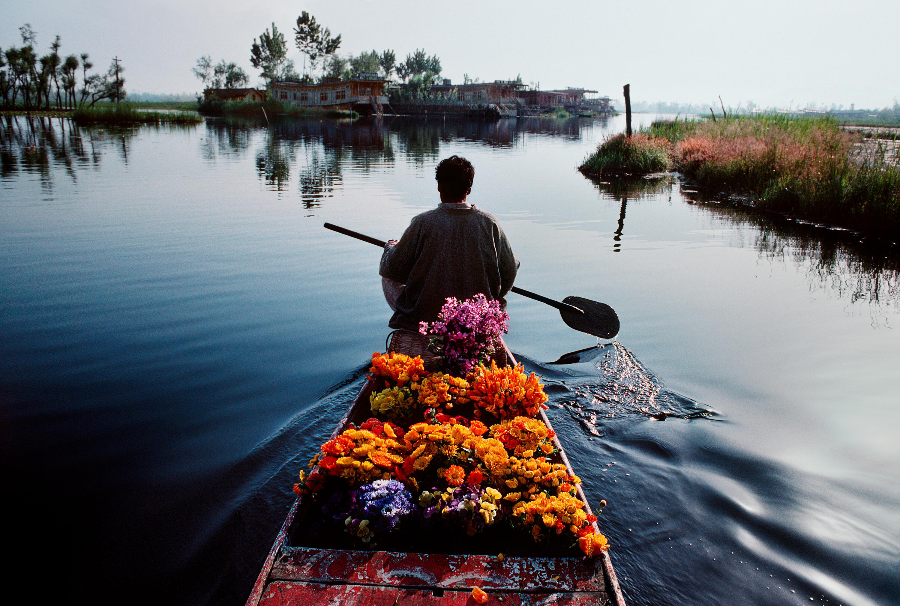 Rowing on Dal Lake - Photograph by Steve McCurry