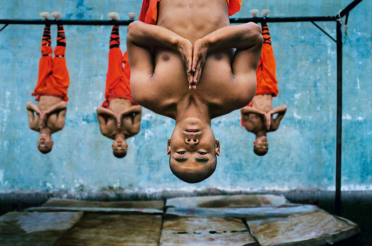 Shaolin Monks Training by Steve McCurry is listed as a 20 x 24-inch digital c-print, available in an edition of 30. This photograph is printed on FujiFlex Crystal Archive Supergloss Paper. It is signed on print verso by Steve McCurry, and inscribed
