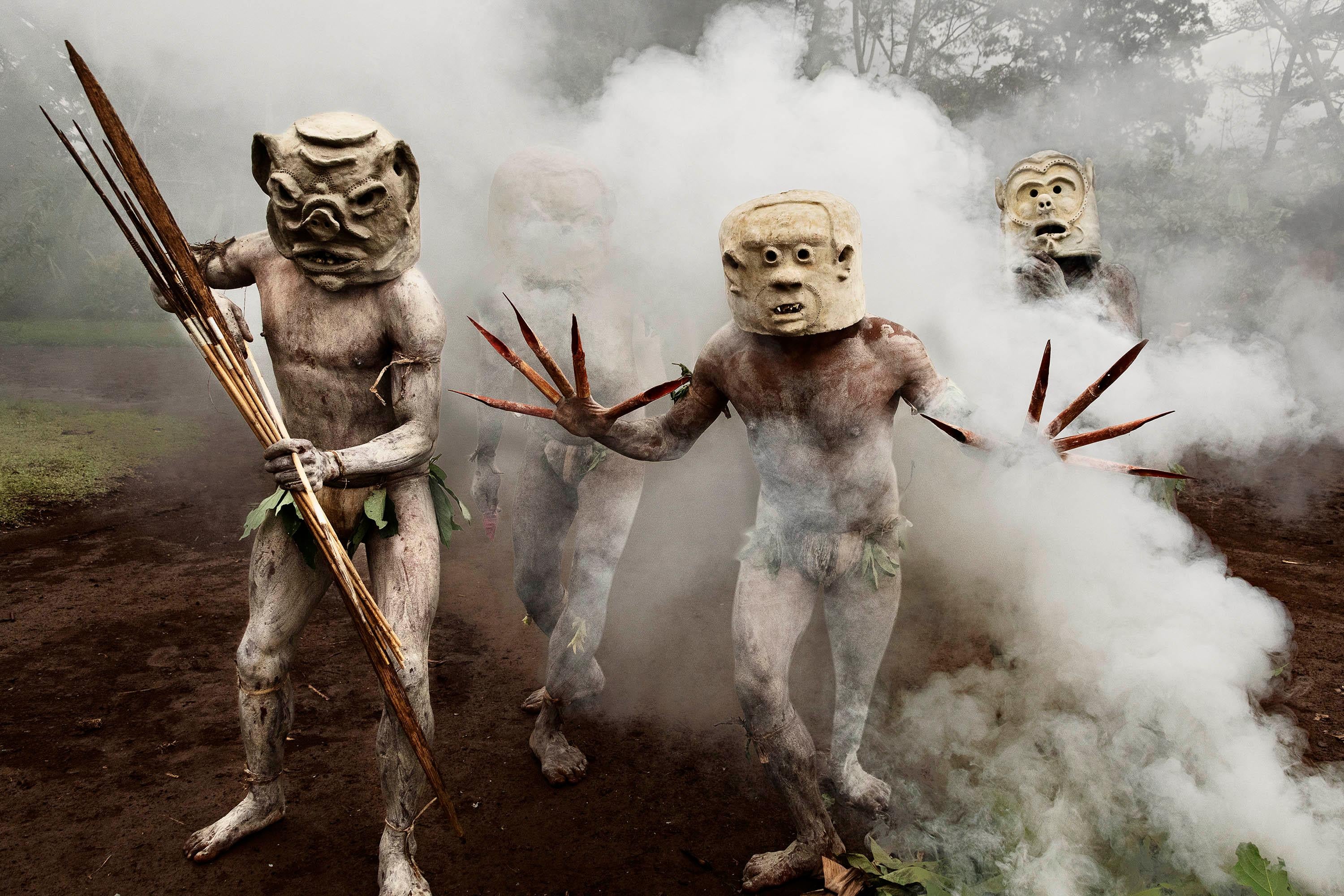 Tribesmen with Clay Masks and Bamboo Garb, Papua New Guinea