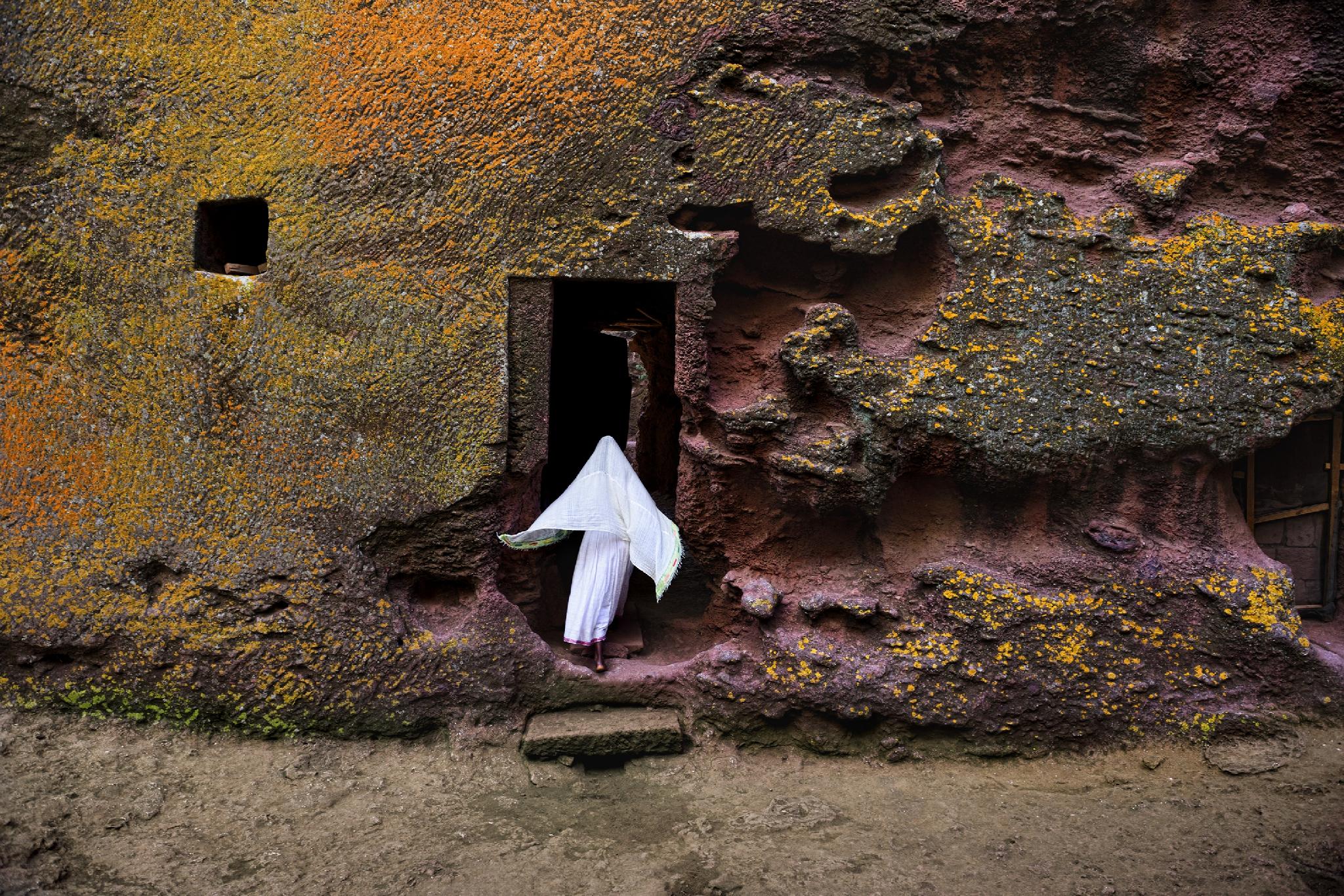 Woman Enters Medieval Rock-Hewn Church, Ethiopia