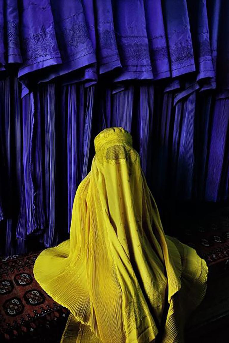Woman in Canary Burqa, Afghanistan, 2002 - Steve McCurry (Colour Photography)
Signed and numbered on photographer’s edition label on reverse
Digital c-type print

24 x 20 inches 
30 x 40 inches 
40 x 60 inches 

Steve McCurry (born 1950) is best