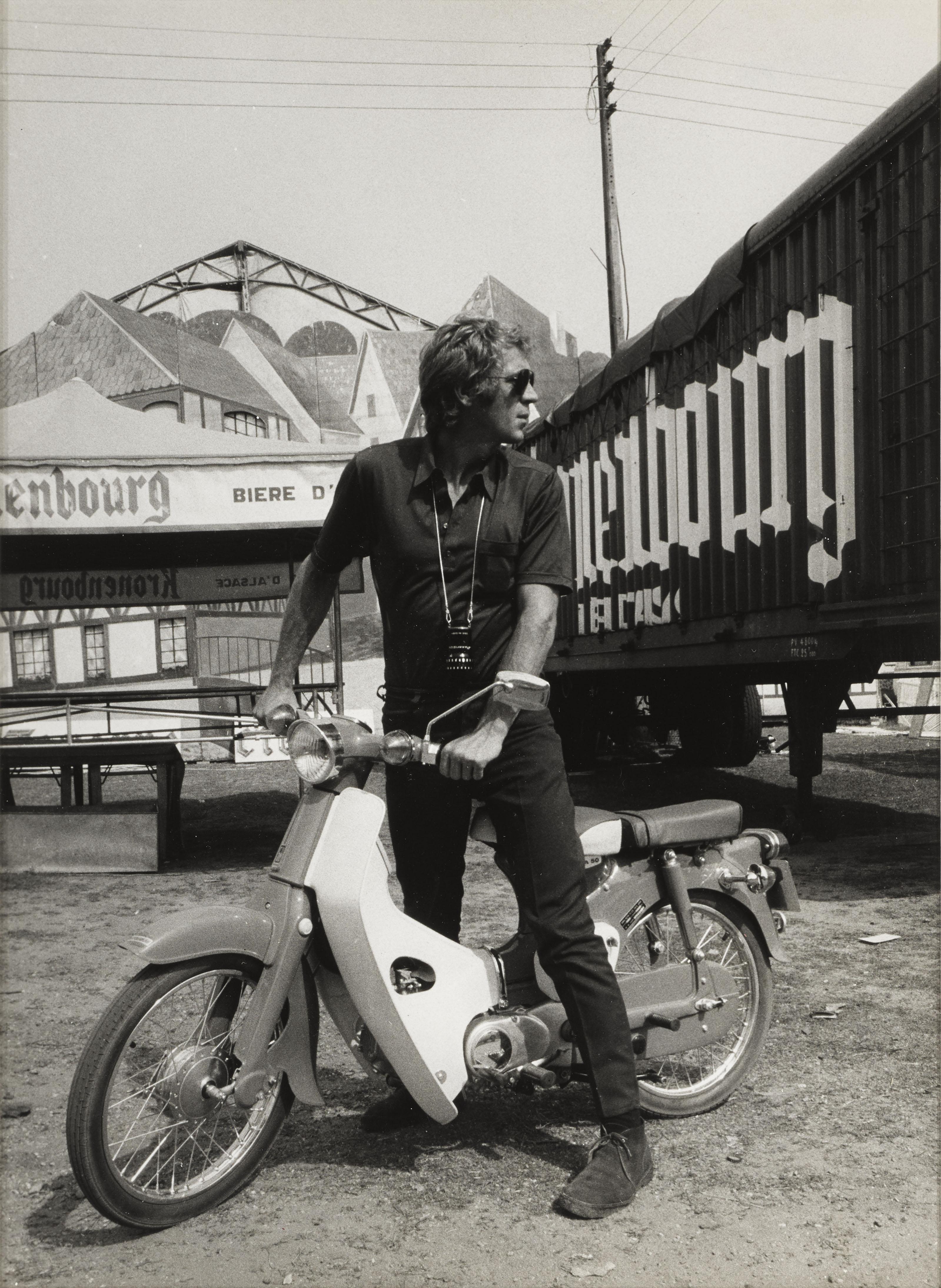 Original photograph from Reporters Associes Paris c.1970 with Steve Mcqueen on a moped with sunglasses and light meter. This production still is conservation framed in a Sapele wood frame and card mount with UV plexiglass.
The size given is before