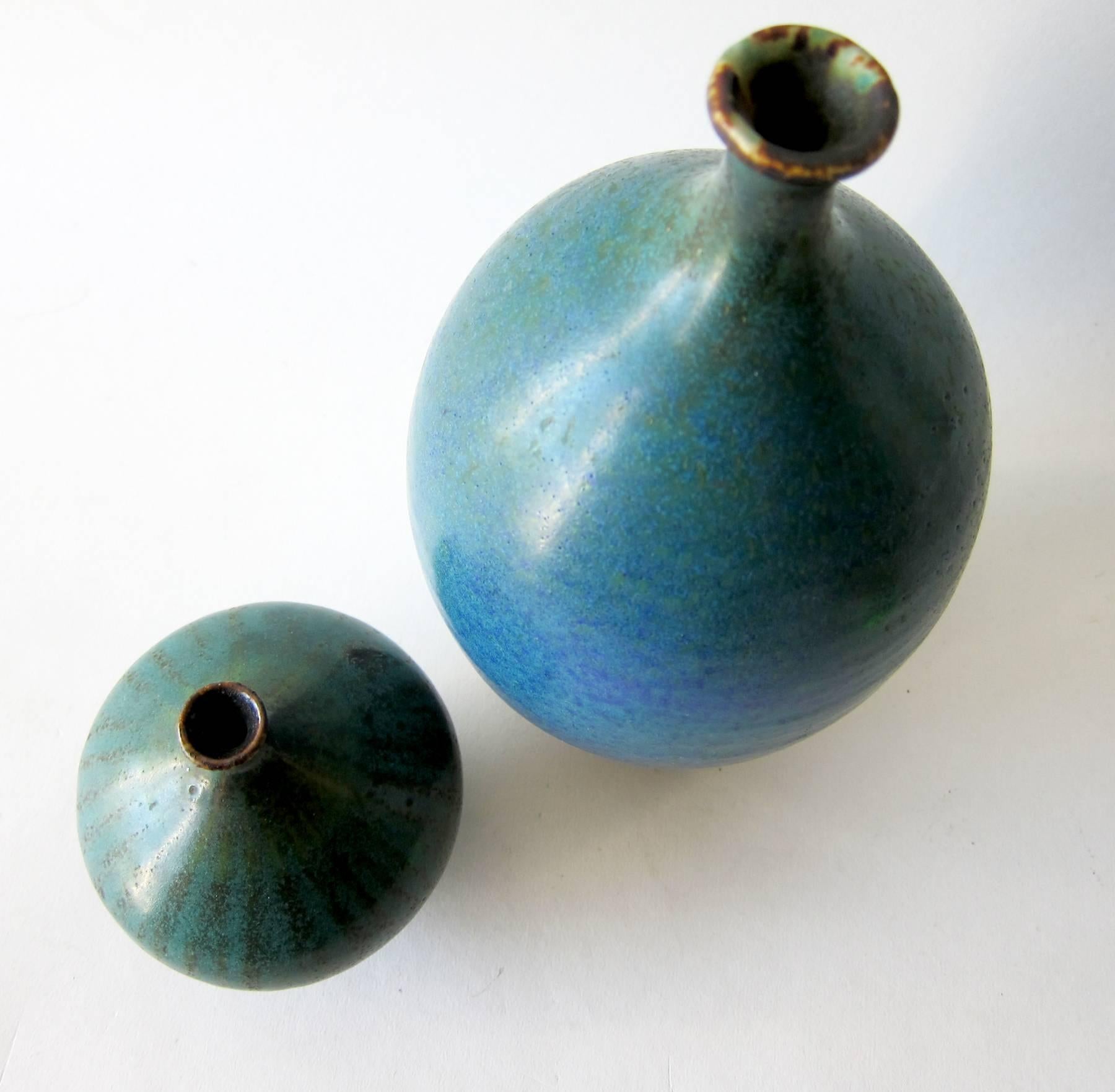 Pair of stoneware weed pot vases by California studio potter, Steve Salisian. Vases measure 8.5” and 5”. Signed Salisian and in excellent vintage condition.
    