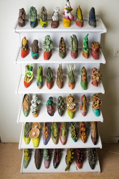 Shoe Wall - cast bronze shoe sculpture installation