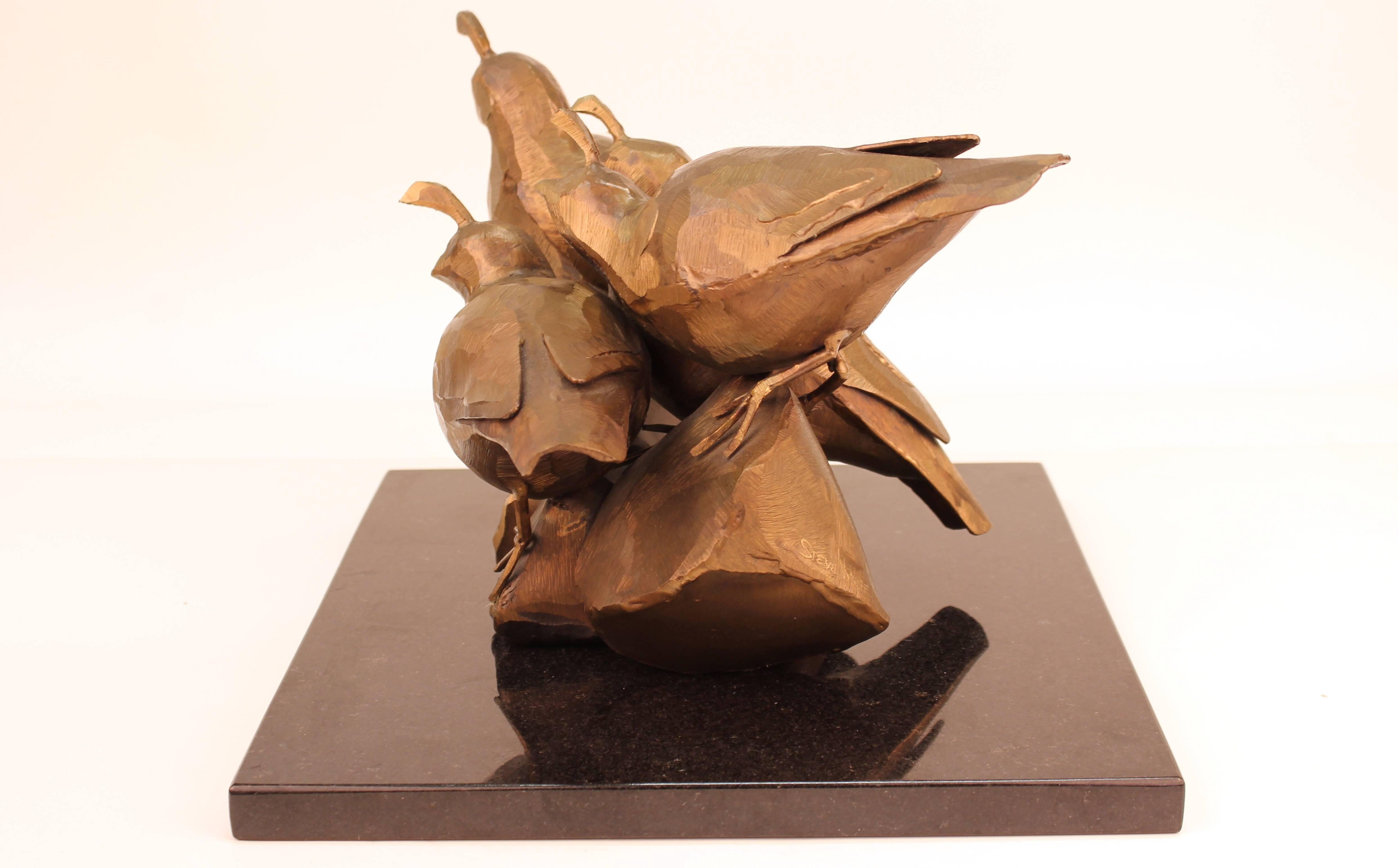Steve Tyree sculpture of quails in hollow bronze. Four abstract quails huddle together on an uneven rocky surface. The statue stands on a black marble base that can be detached. The sculpture is signed on the edge of one of the 'rocks'. Wear