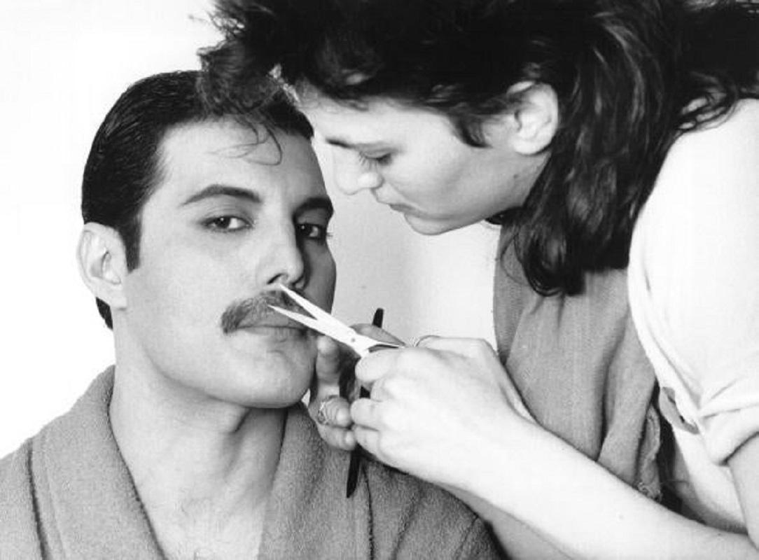 "Grooming Freddie" by Steve Wood

1982: Rock singer Freddie Mercury (Frederick Bulsara, 1946 - 1991), of the popular British group Queen, has his moustache groomed.

Unframed
Paper Size: 20" x 24'' (inches)
Printed 2022 
Silver Gelatin Fibre Print