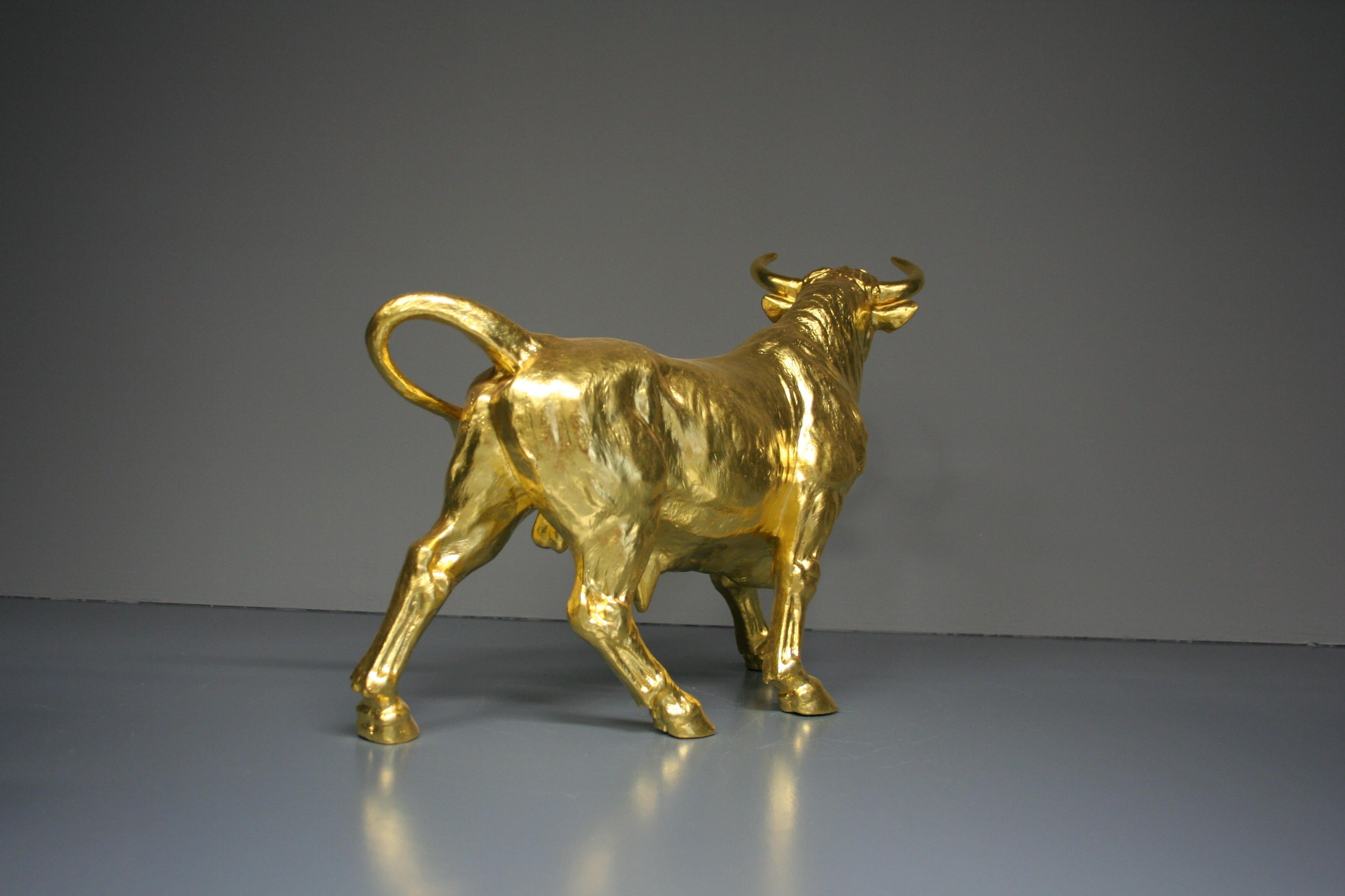 Traditional gold-plated bull with 24k gold leaf. This bull can be placed both outside and inside. The dimensions are aprox. 28 x 11 x 40 cm.