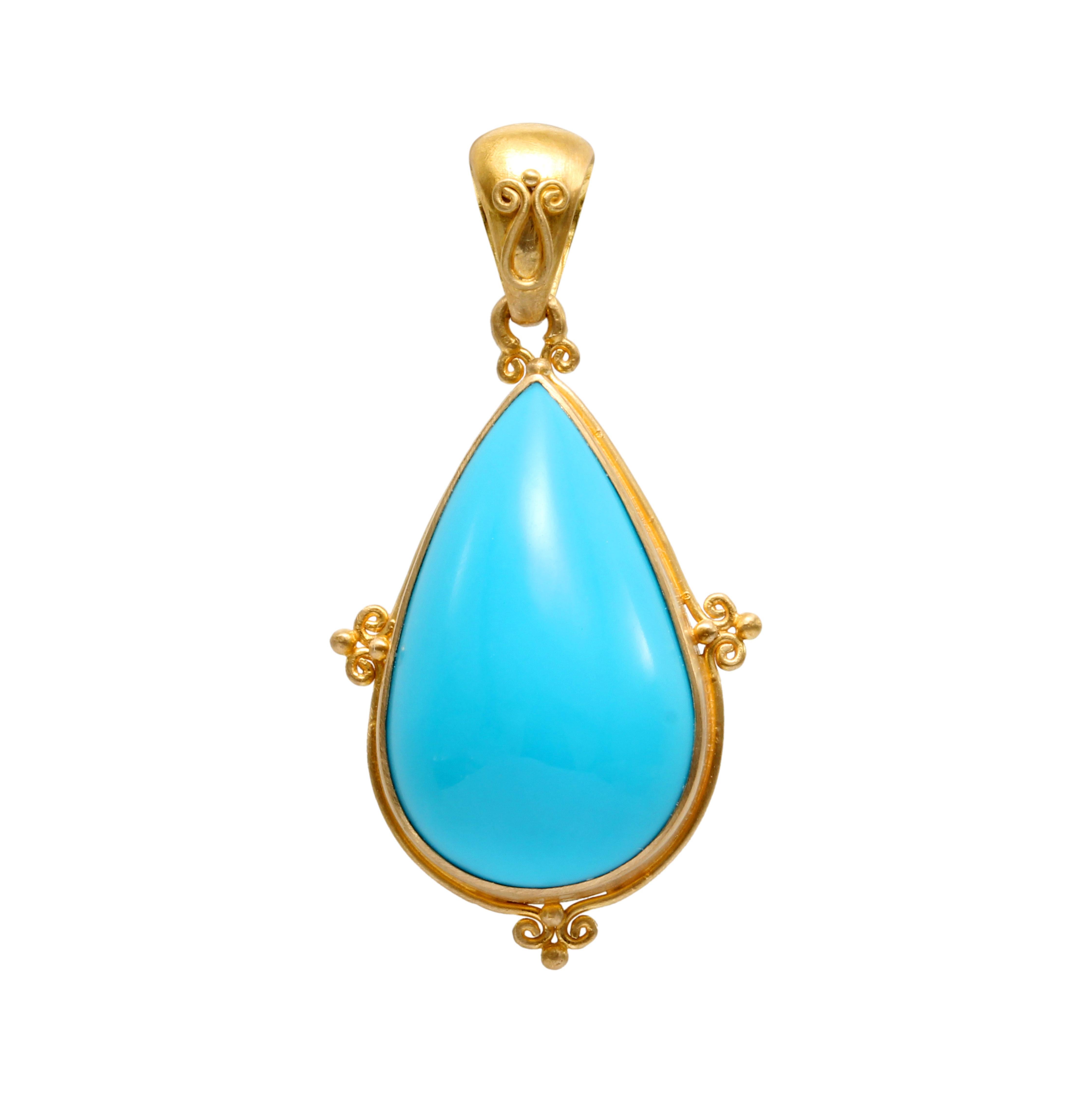 A bright and flawless 12 x 29 mm pear shaped Arizona Sleeping Beauty mine turquoise cabochon is set in a delicate artisanally crafted 