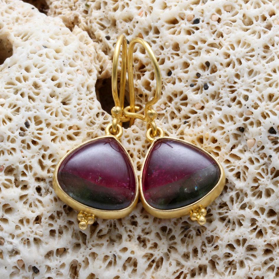 Two 12mm wide drop shaped watermelon tourmaline cabs with greens at the bottom merging into a deep reddish pink at the top dangle simply on safety-clasp  18K gold ear wires with a tiny triple 
