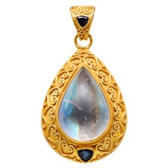 Steven Battelle Pendentif en pierre de lune arc-en-ciel 11,5 carats et saphir bleu 22 carats