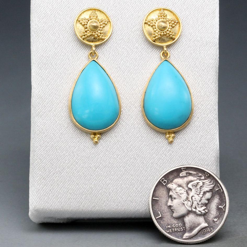 Two flawless 11 x 16 mm drops of clean Arizona Sleeping Beauty Mine Turquoise are suspended below handmade geometrically granulated 10 mm posts with a small granulation accent at bottom.  A nicely balanced combination of shapes and colors with just