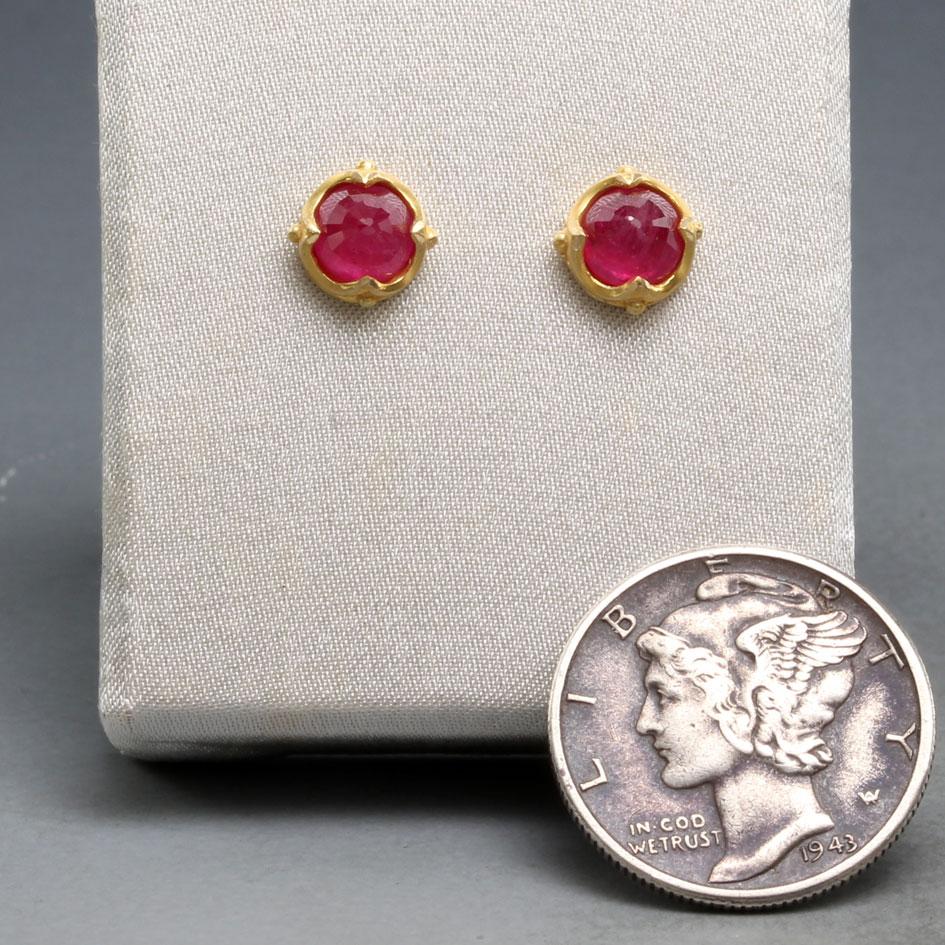 Two 5mm domed rose faceted Thailand rubies are set in our signature 