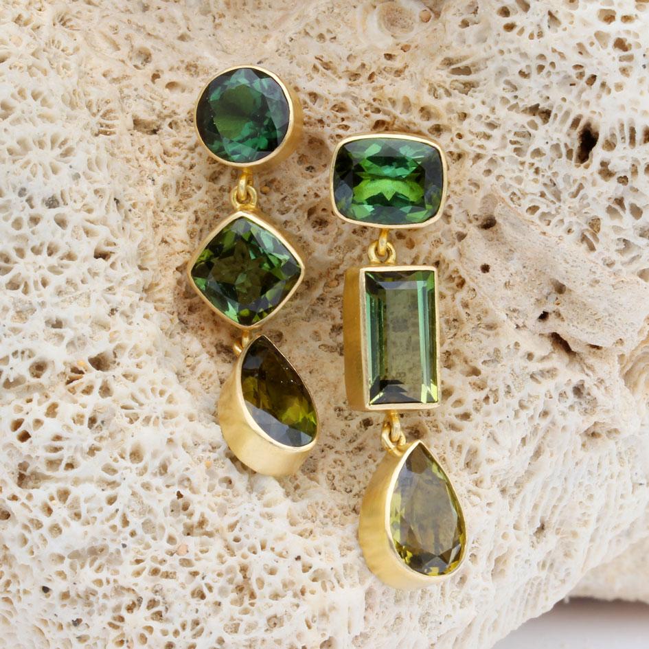 Six different shapes and shades of faceted Brazilian green tourmalines are set in handcrafted matte-finish 18K gold bezels in this one of kind post earring design. The sizes vary between 7 mm to 10 mm in length and the shapes between round, cushion,