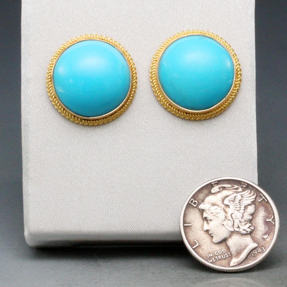 Two perfect 14 mm round cabochons from the Arizona Sleeping Beauty mine turquoise are highlighted with 18K gold double twist wire bezels in this splash of bright color.  Classic and elegant!