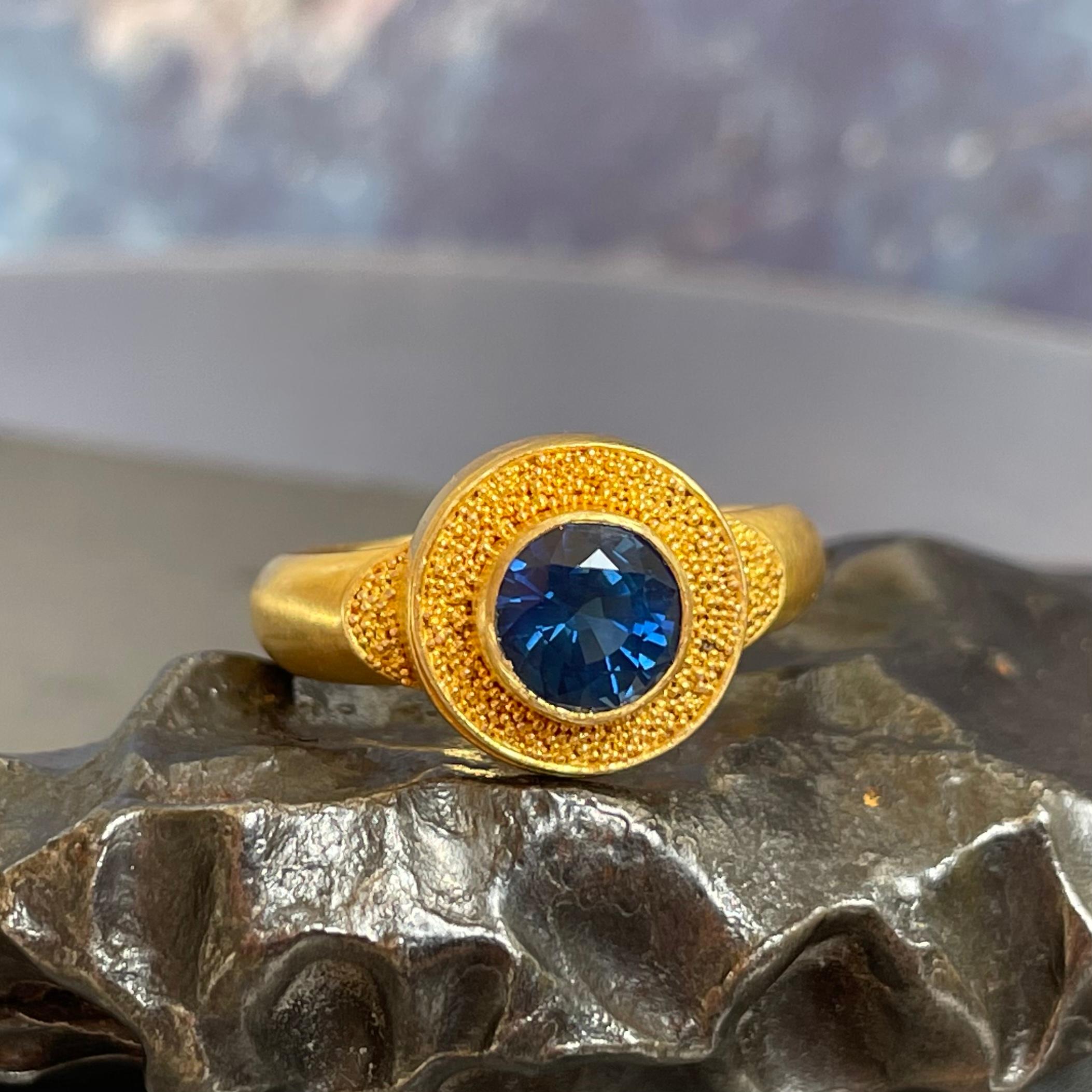 A brilliant 6 mm Sri Lankan untreated Blue Sapphire is set surrounded by fine 