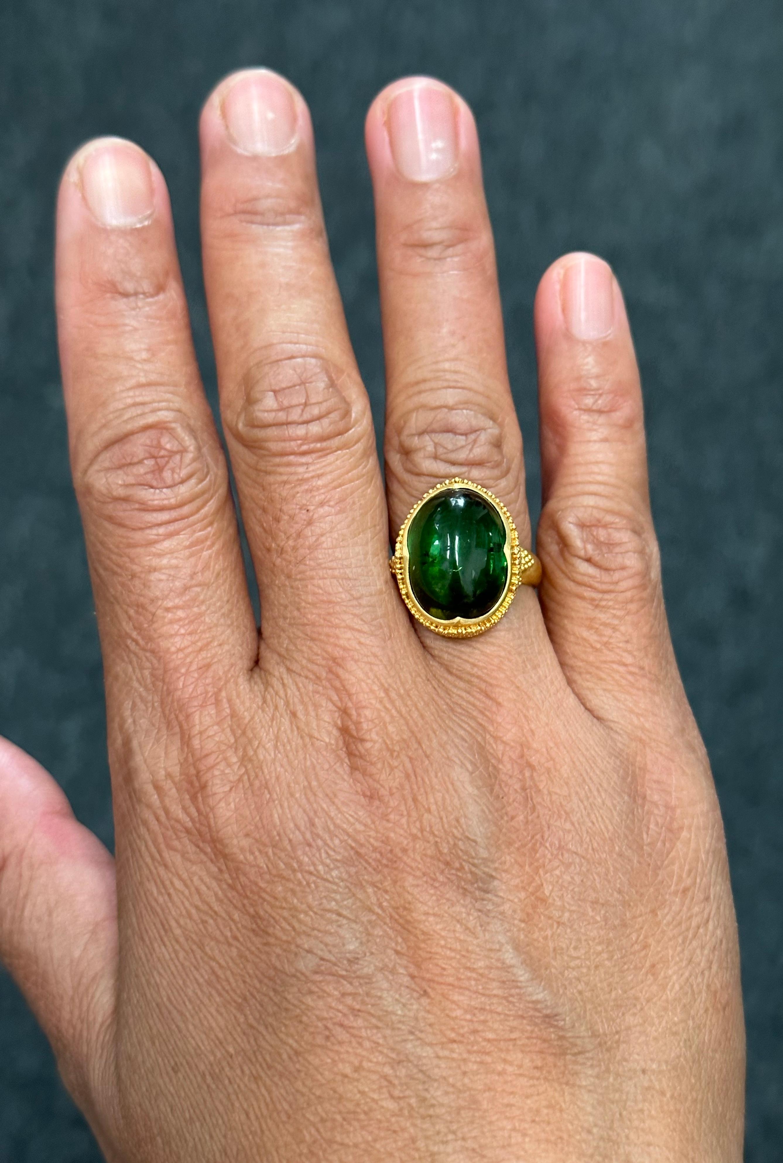 gold rings with green stone