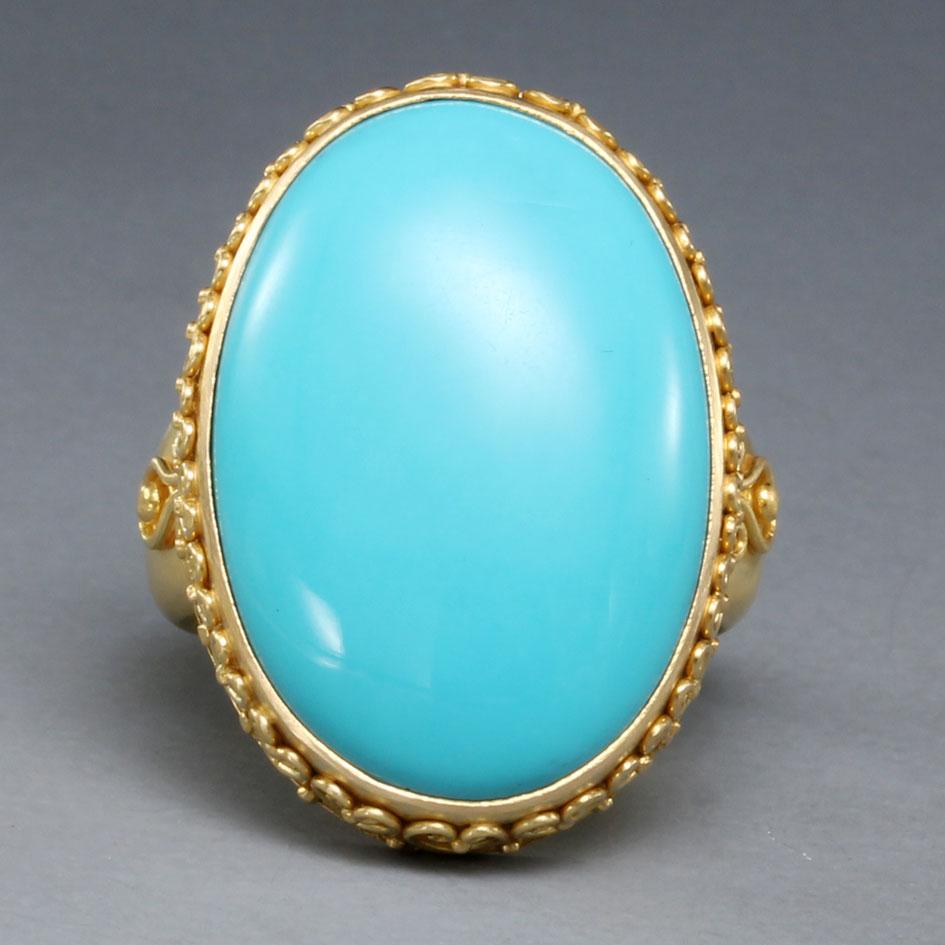 A large oval 17 x 25 mm flawless cabochon of Arizona Sleeping Beauty mine turquoise is set in this wonderful 