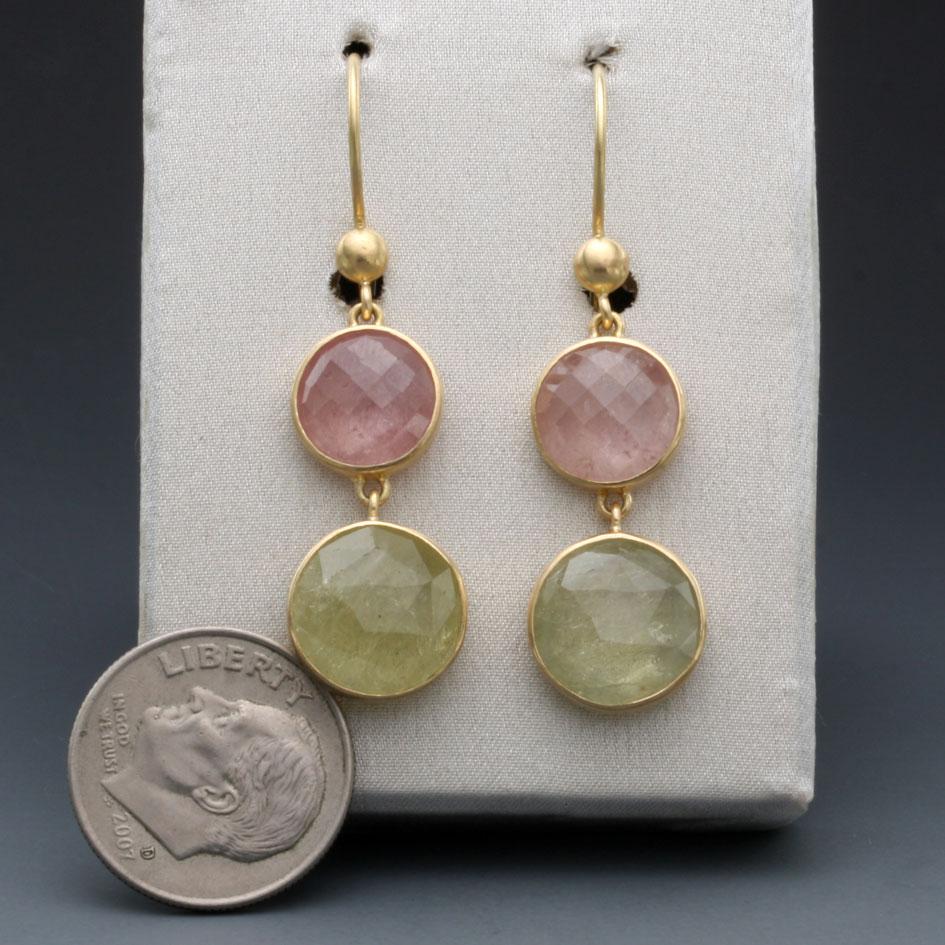 Two 11 mm round checkerboard faceted light yellow sapphires dangle below slightly smaller 9 mm rose pink ones, all suspended on safety clasp wires with a small circular component at the join.  A delicate color combination of pastel shades. Delicious