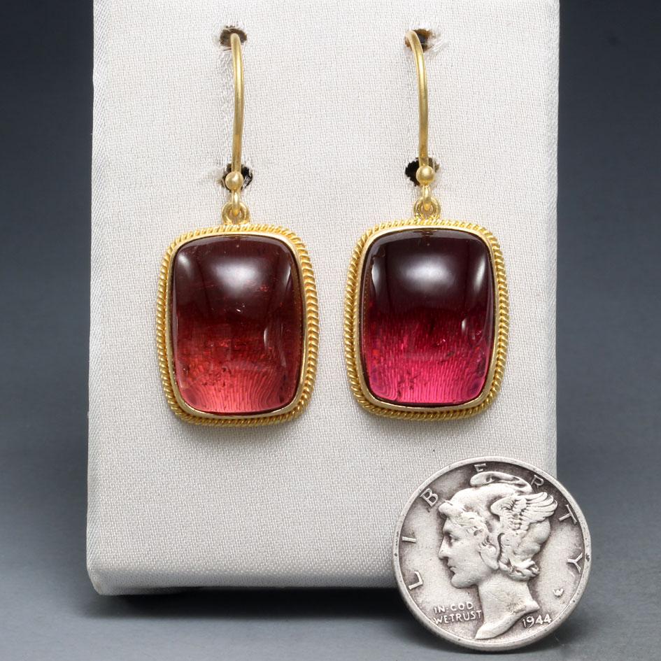Two juicy  12 x 16 mm cushion shaped Mozambique pink tourmalines are set in classic 