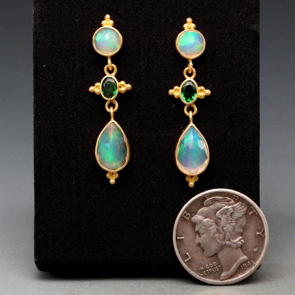 Four flashing blue and green Ethiopian Opal round and pear shaped rose cuts are combined with a complementary brilliant oval 3 x 5 mm green tsavorite between in this Steven Battelle post earring design. A beautiful combination sure to enchant!