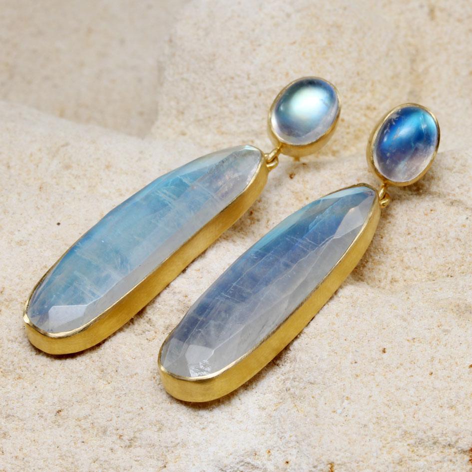 These simple and classic 18K gold post earrings are stunning!  Wonderful long 9 x 32 mm long flashing rose-cut faceted rainbow moonstones are suspended below 6 x 8 mm oval cabochons, all set in simple matte-finish 18K gold bezels. When I saw this