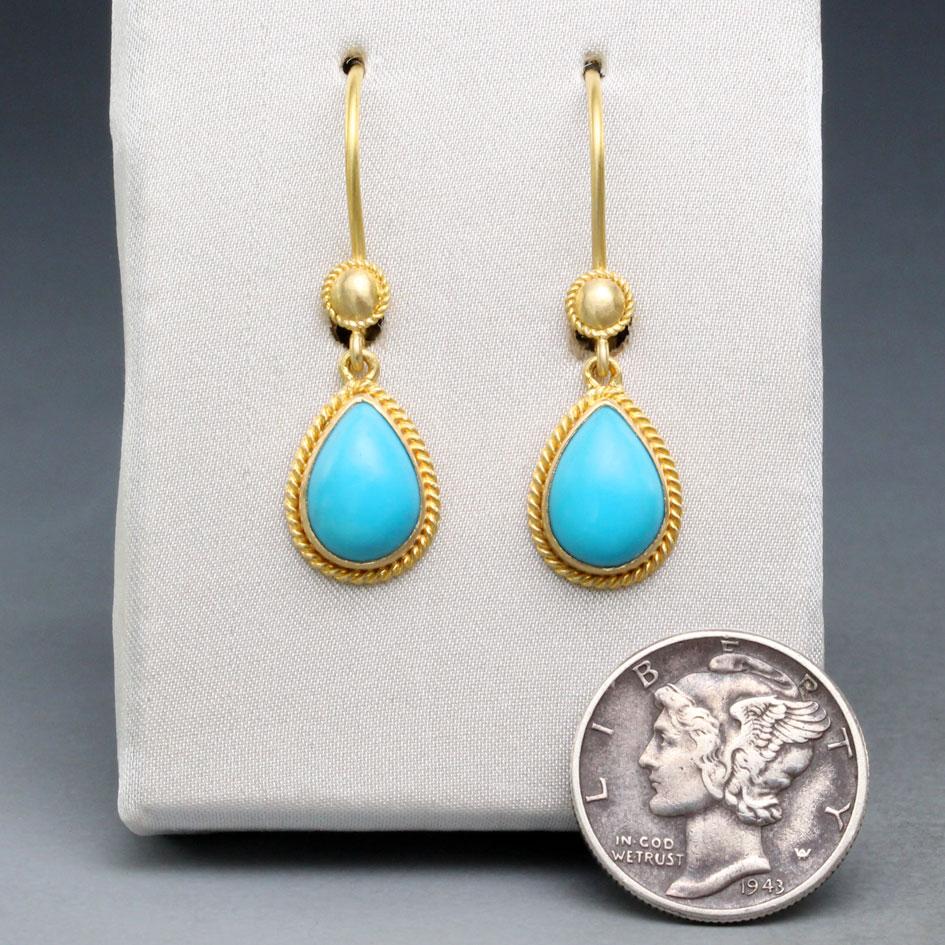 Two outstanding 7 x 10 mm pear shaped Arizona Sleeping Beauty mine cabochons are accented by classic braided wire bezels beneath a matching circular accent above the jump rings.  Safety clasp wires protect.  Bright colors and elegant style ! 