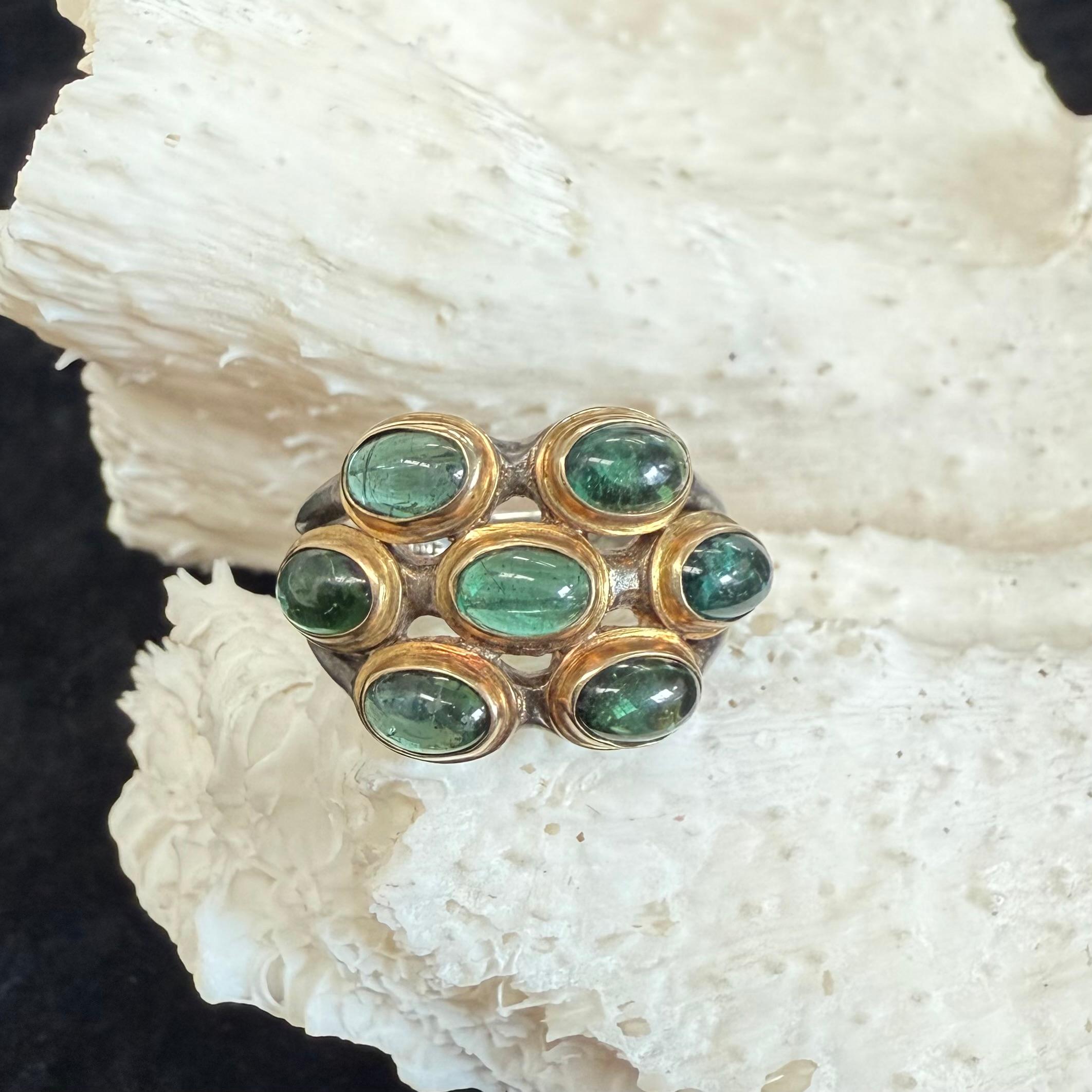 Seven 4 x 6 mm cabochon blue-green 