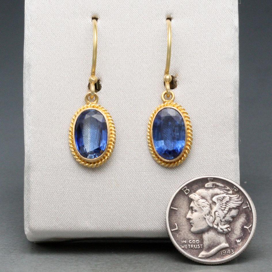 Two lively deep blue 6 x10 mm faceted kyanite ovals are complemented by twist wire accents and suspended below safety clasp wires in this classically simple design.  Beautiful !