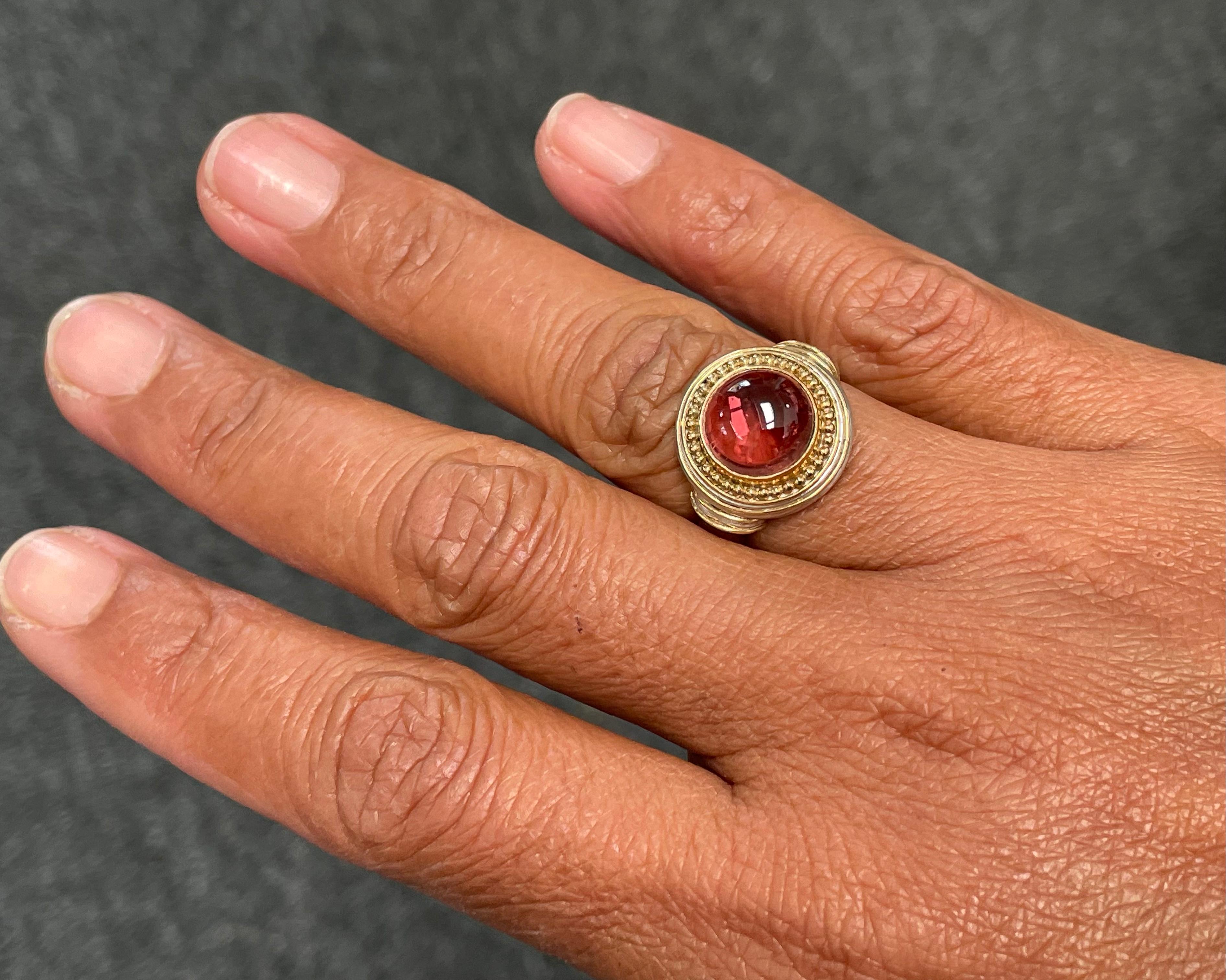 A beautiful 10 mm round pink tourmaline is surrounded by handmade 