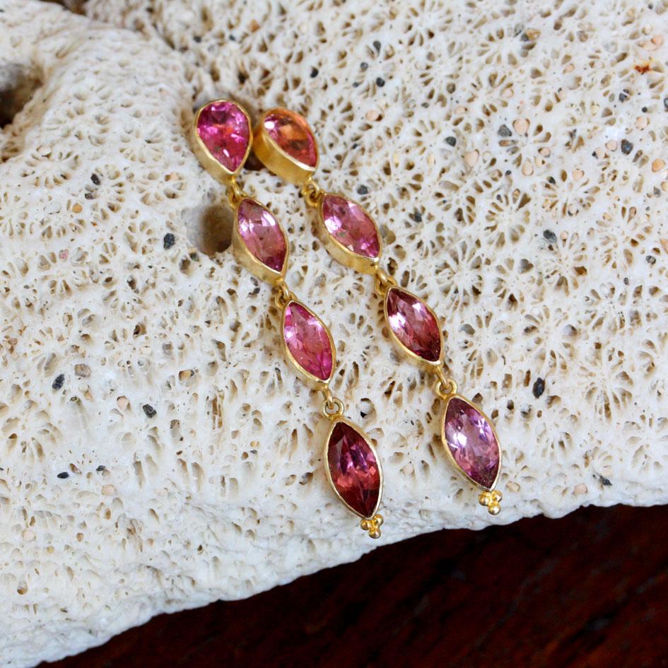 Three graduated sized 4 x 8 to 5 x 10 mm marquis faceted pink tourmalines hang below a 5 x 7 mm pear shaped pink tourmaline posts in this elegant creation.  A lot of beautiful color to sparkle and dangle below your ears.  Wow!