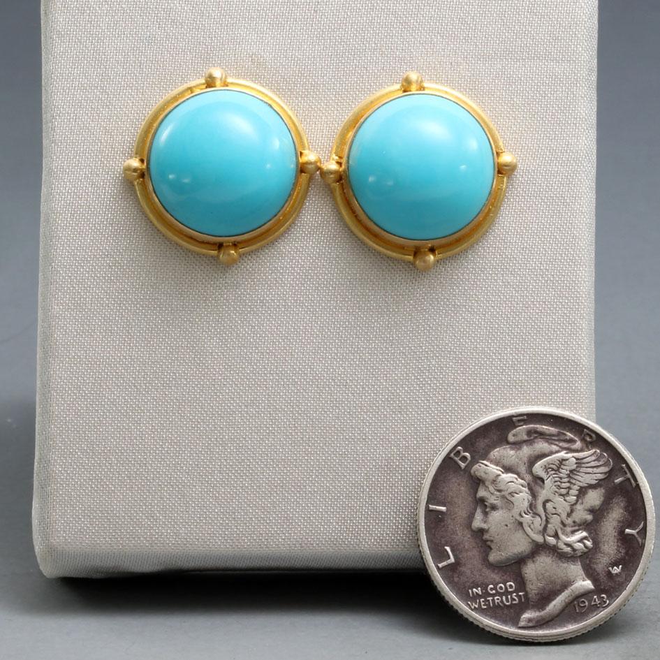 Two flawless and bright 10 mm round cabochons of Arizona Sleeping Beauty mine turquoise are set in handcrafted 18K gold bezels surrounded by subtle gold wire with 4 
