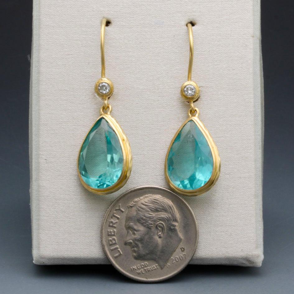 Simply beautiful handcrafted 7 carat Apatite and Diamond drop earrings. 
This stone is thought to expand knowledge and truth and eases sorrow, apathy, and anger. 
Weight 4.03 gram
Length 33mm
Apatite size 10x12mm pear
Diamond size 1.7mm