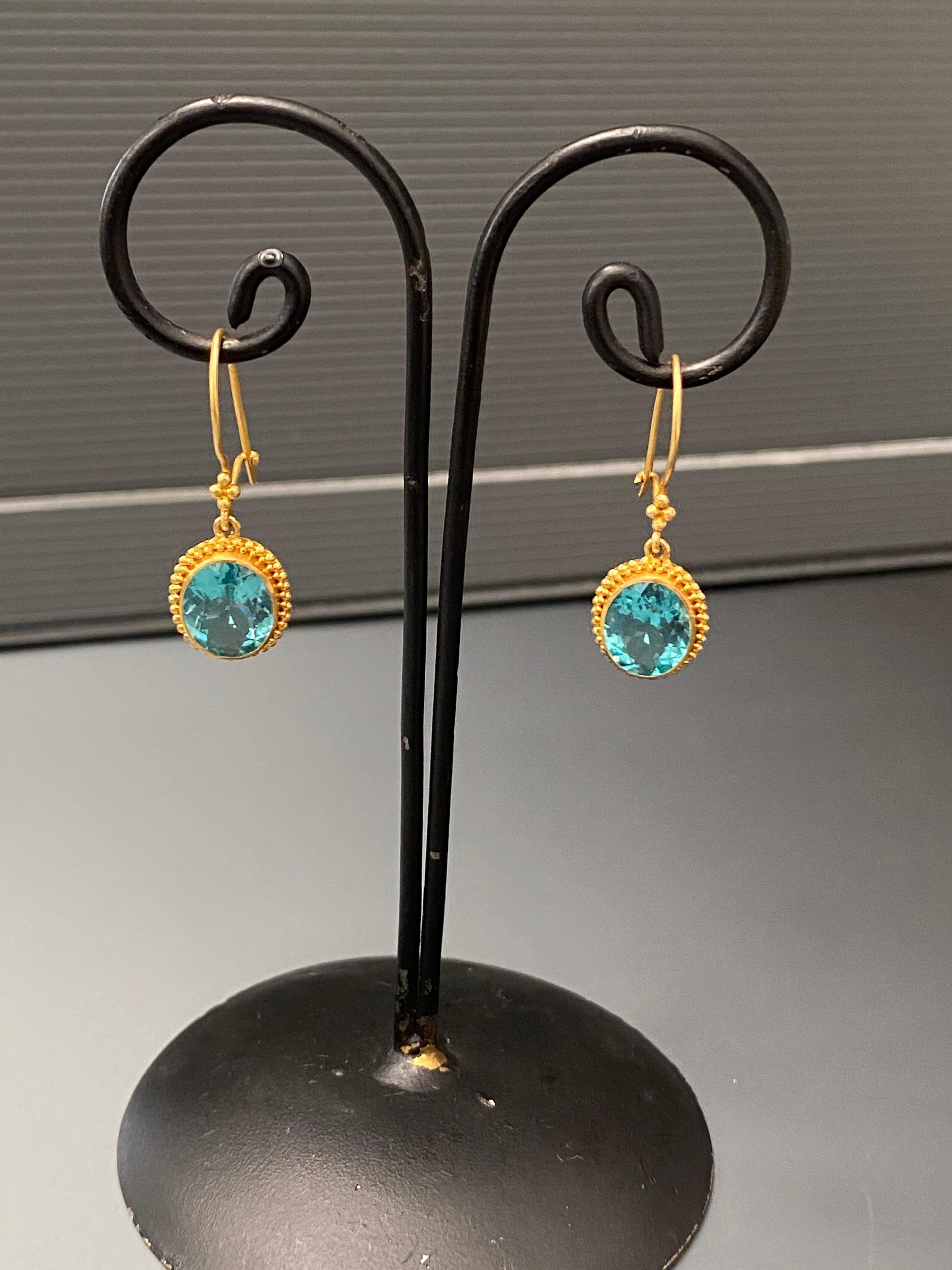 Ancient inspired drop earrings handcrafted in a beautiful granulated 22K setting.  
5.5 Carats of brilliant Brazilian apatite. The safety clasps provide security when worn.
Length is 33mm.  Total weight 3.3 5 grams
Stone size 8x10mm oval faceted. 
