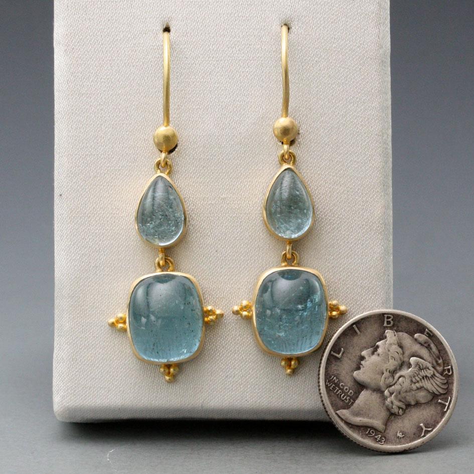 Steven Battelle handcrafted 13.6 Carat 4 stone Aquamarine cabochon earrings set in 18K gold in a classic beautiful simple setting with granulated accents.   Safety clasp. Length 42mm.
Stones size 6x9 pear, 9x11 cushion.
